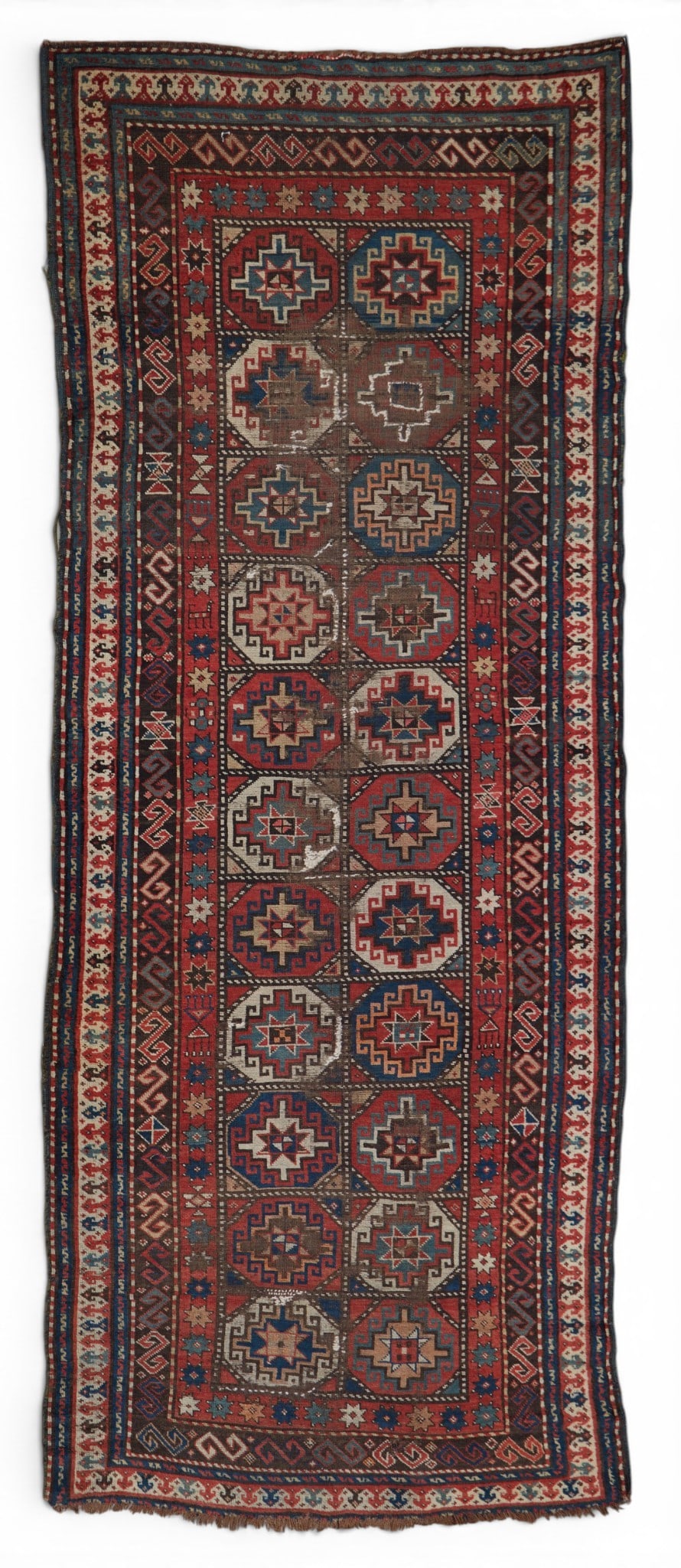 A Kazak rug, Caucasus: A Kazak rug Caucasus approximately 3ft 7in x 9ft 3in (112x283cm)