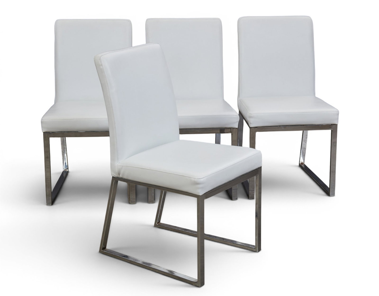A set of four contemporary dining room chairs with chrome base: A set of four contemporary dining room chairs with chrome base height 35 x width 18 x depth 23 in. (88.9 x 45.7 x 58.4 cm.)