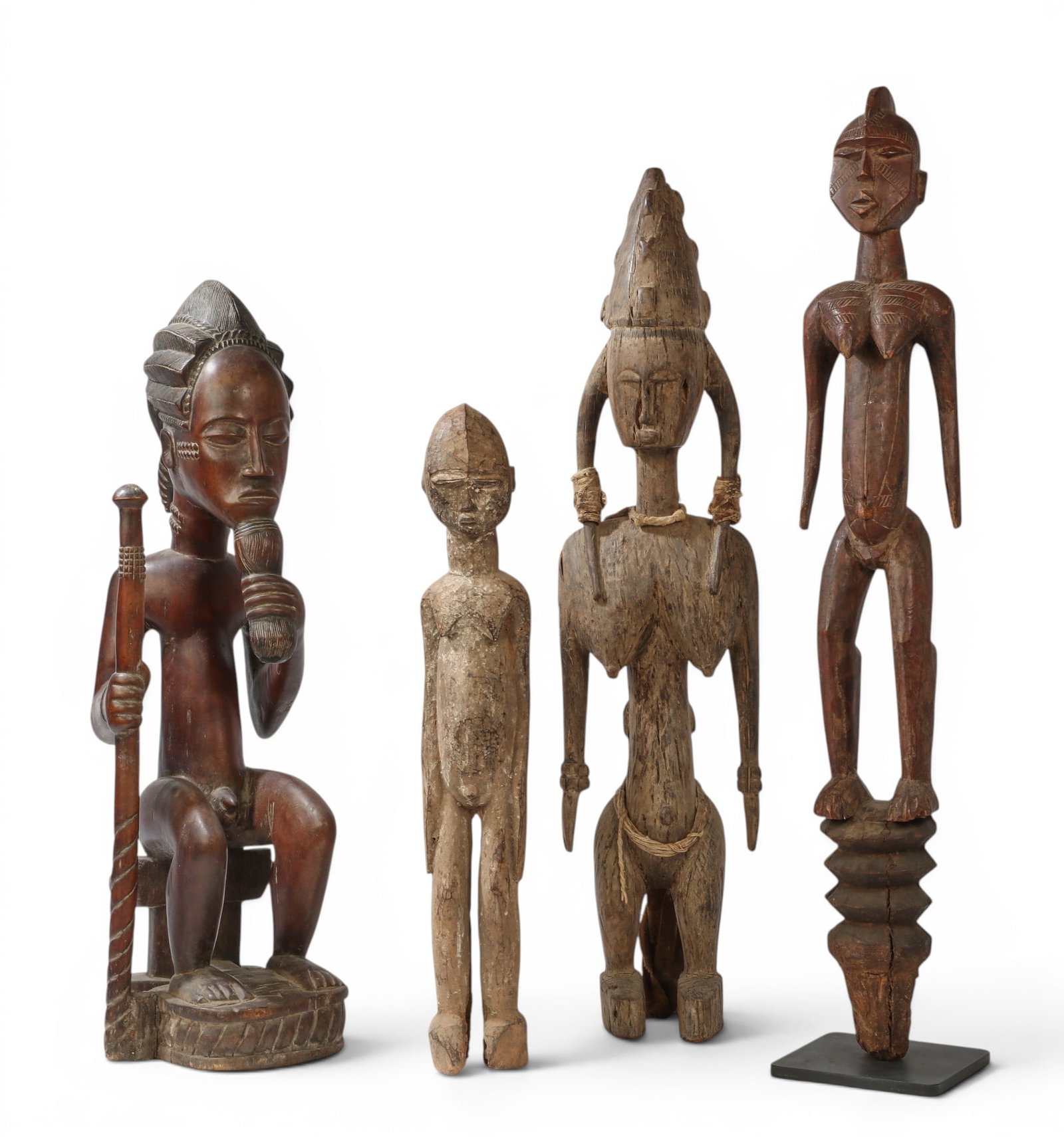 A group of four West African sculpted hardwood figures, possibly Makonde and Mumuye cultures (1 of 5)