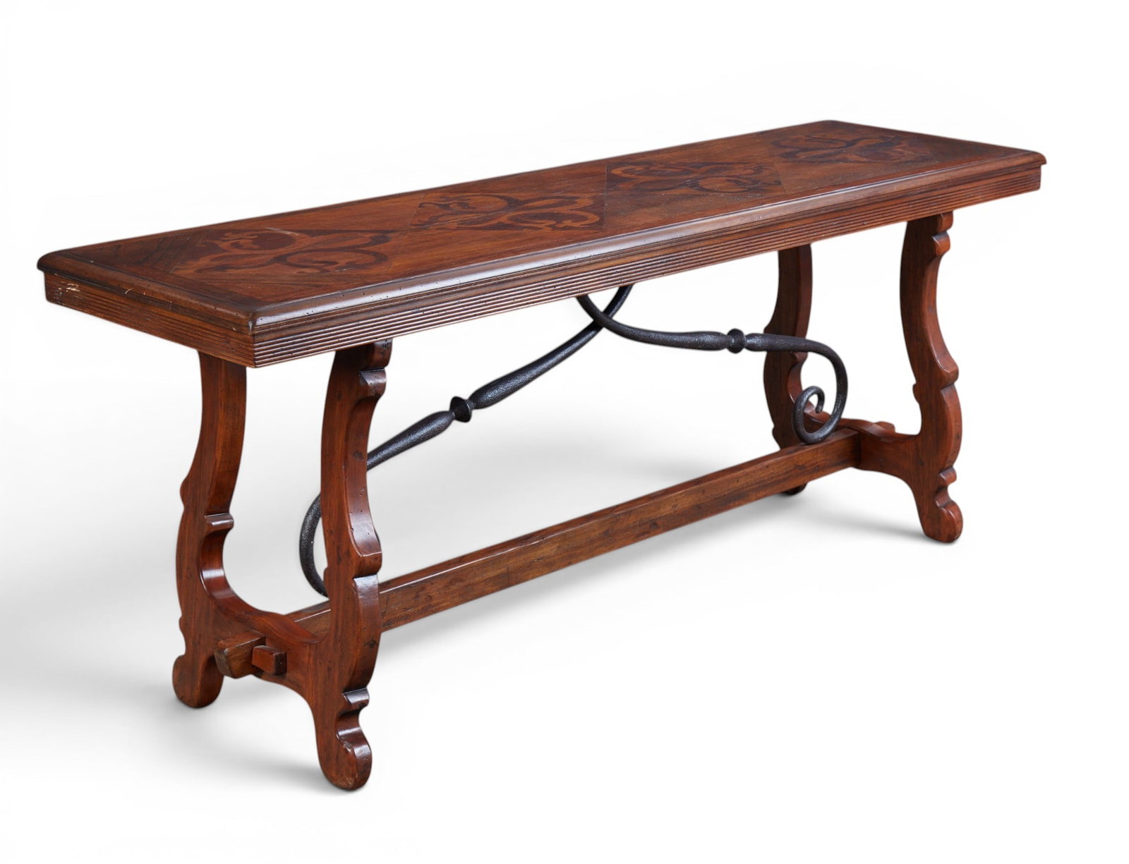A spanish baroque style trestle table with inlaid top: A spanish baroque style trestle table with inlaid top height 31 x width 73 x depth 22 in. (78.7 x 185.4 x 55.9 cm.)