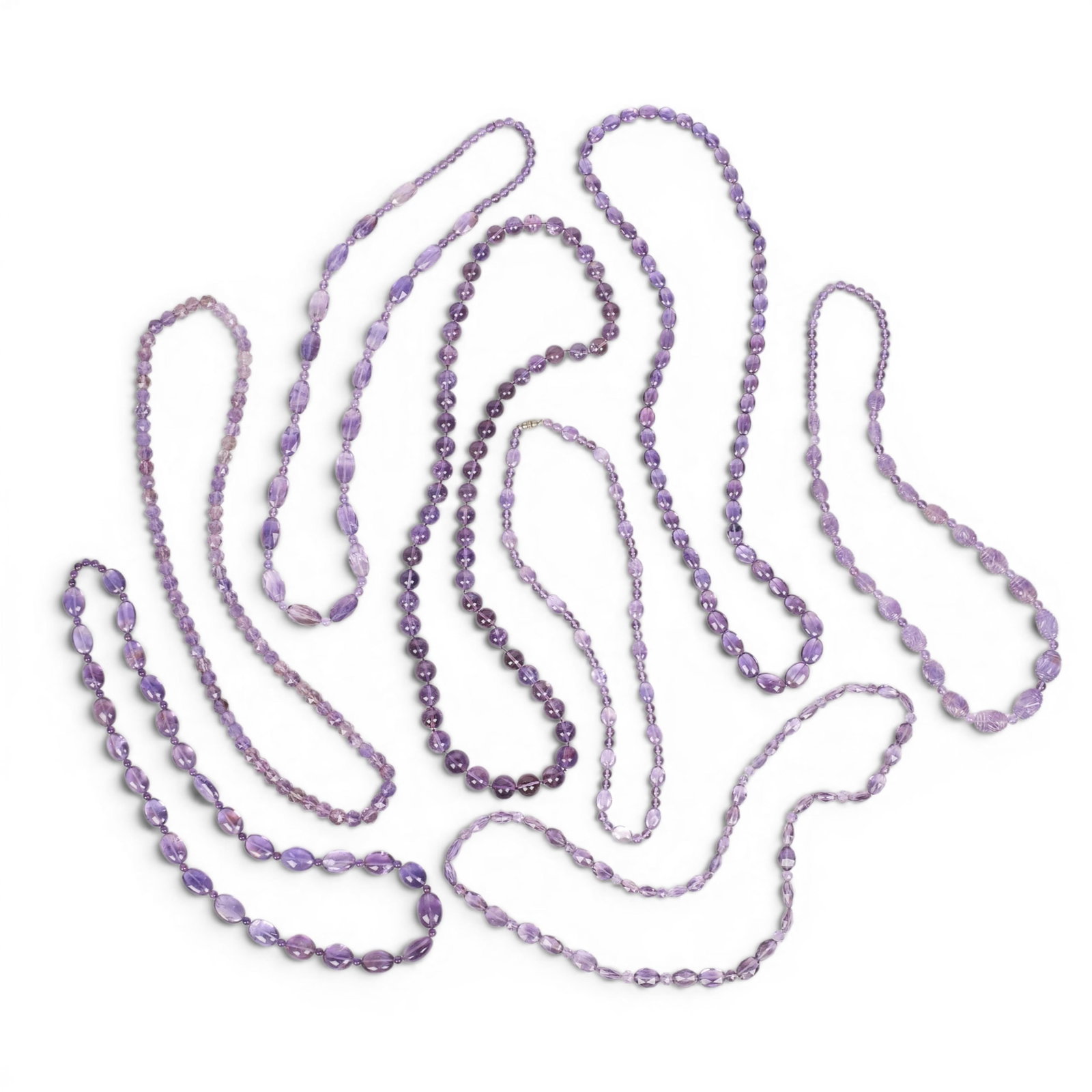A group of eight amethyst bead necklaces.: A group of eight amethyst bead necklaces.