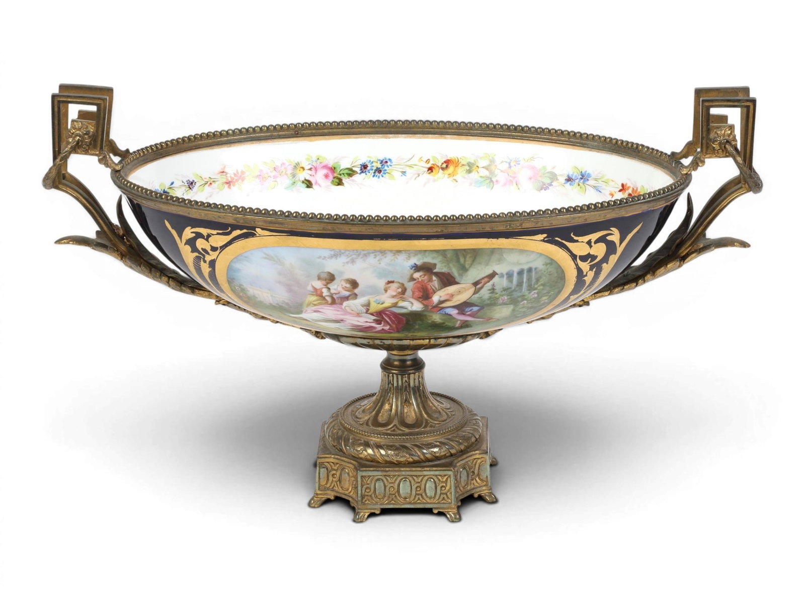 A Sevres style porcelain center piece with bronze mounts: A Sevres style porcelain center piece with bronze mounts height 10 x width 18 x depth 9 1/2 in. (25.4 x 45.7 x 24.1 cm.)