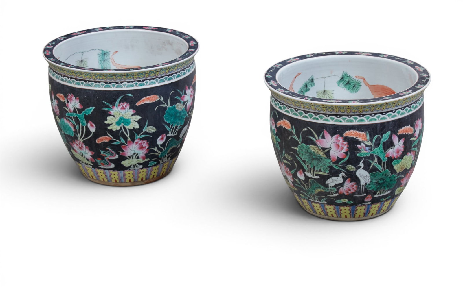 A pair of Chinese Famille Noir porcelain jardinieres: A pair of Chinese Famille Noir porcelain jardinieres height 13in (33cm); diameter 15 1/2in (39.5cm)