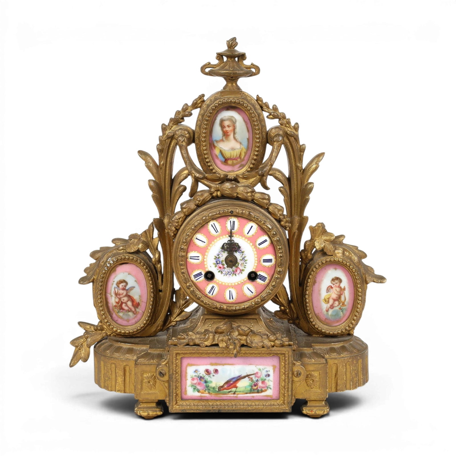 A bronze table clock with porcelain plaques: A bronze table clock with porcelain plaques height 13 x width 10 x depth 5 in. (33 x 25.4 x 12.7 cm.)