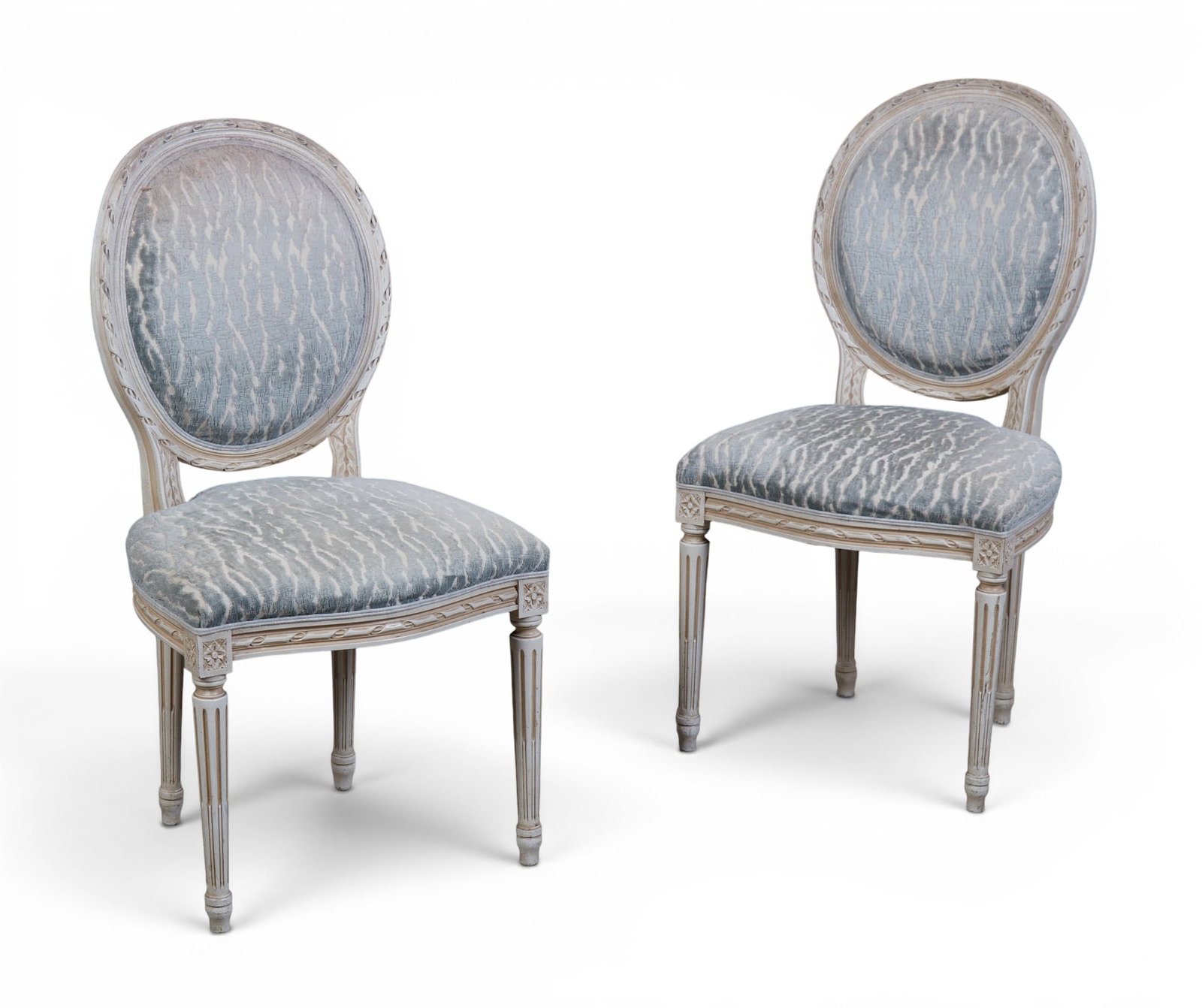 A pair of Louis XVI style white painted chaises, modern: A pair of Louis XVI style white painted chaises modern height 38in (96.5cm); width 20in (51cm); depth of seat 16in (40.5cm)