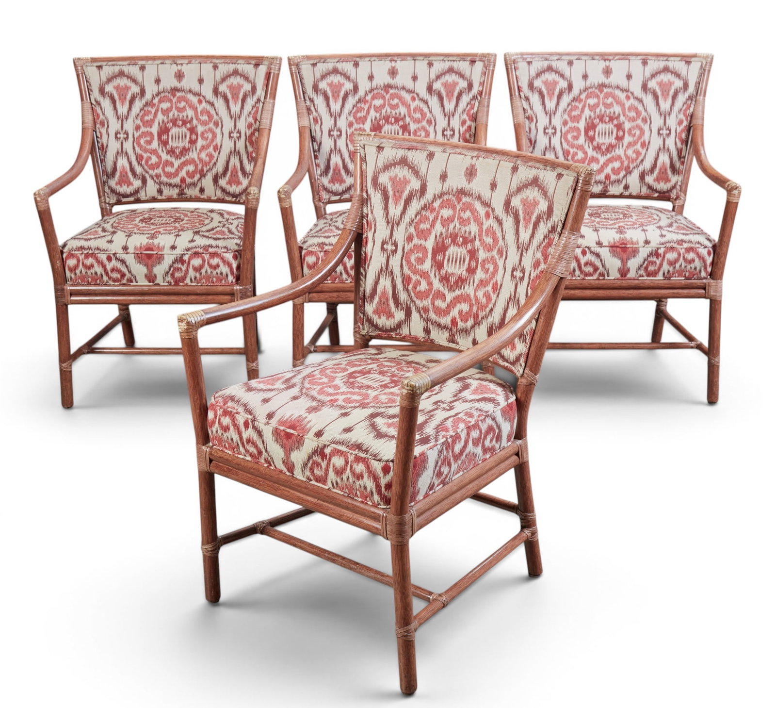 A set of four McGuire bamboo armchairs: A set of four McGuire bamboo armchairs height 36 x width 23 x depth 23 in. (91.4 x 58.4 x 58.4 cm.)