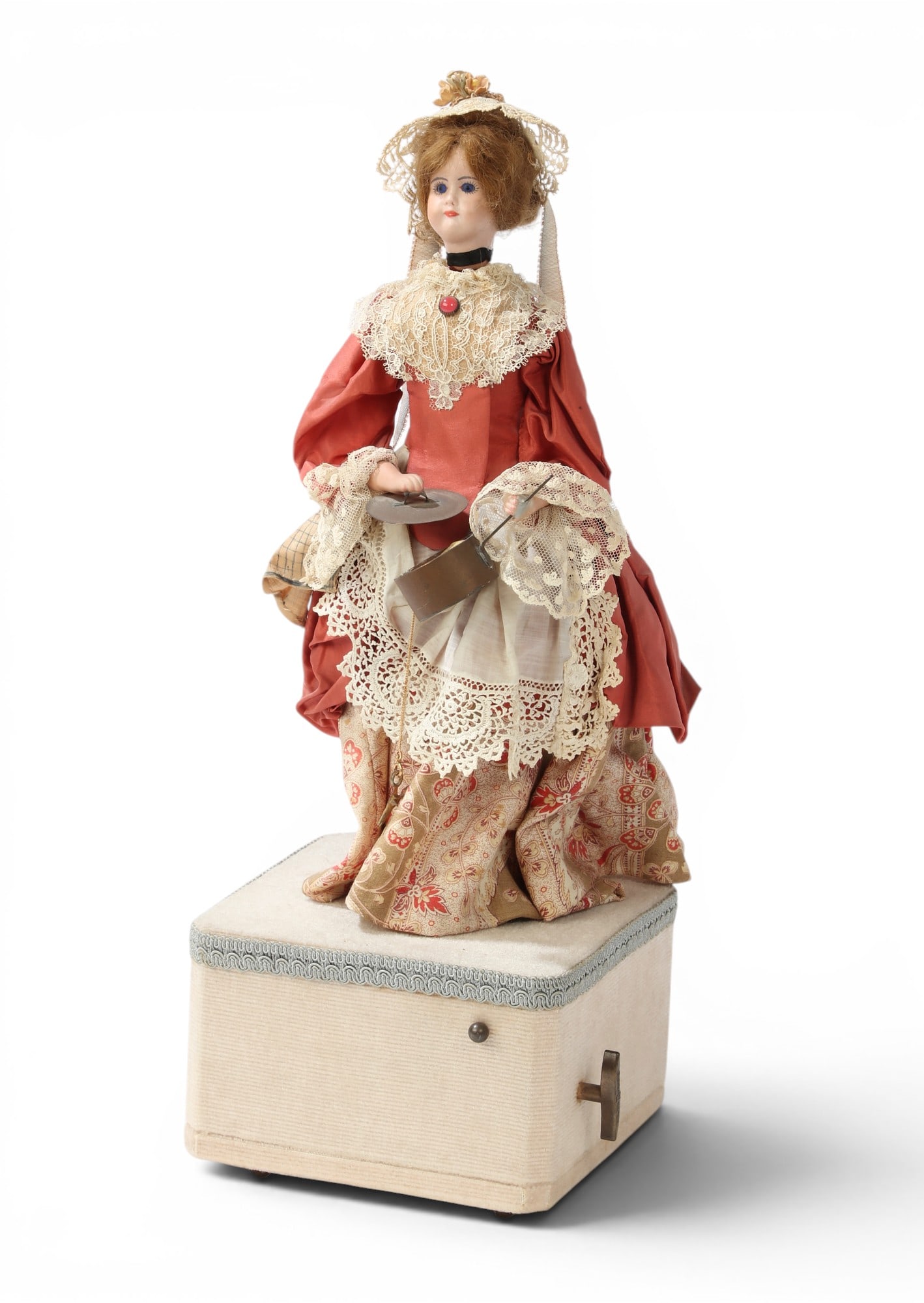 A standing lady with a pan automaton: A standing lady with a pan automaton height 17 x width 6 1/4 x depth 6 1/4 in. (43.2 x 15.9 x 15.9 cm.)