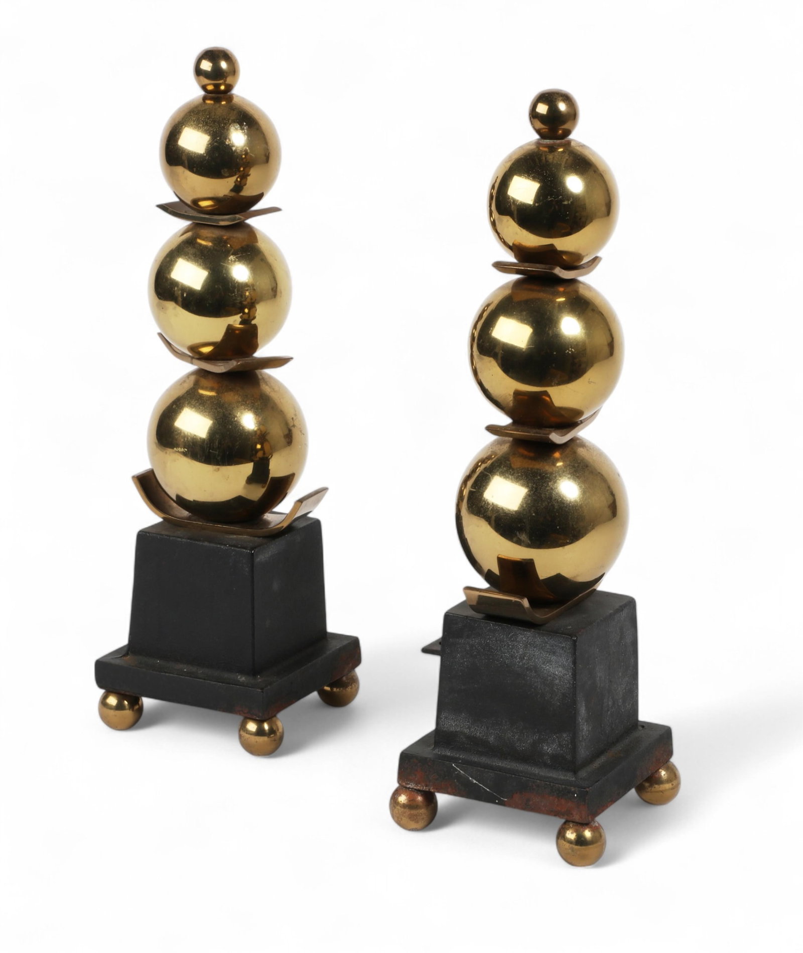 A pair of Modernist iron and brass chenets: A pair of Modernist iron and brass chenets height 16 1/2in (41cm); width 5in (12.5cm) square