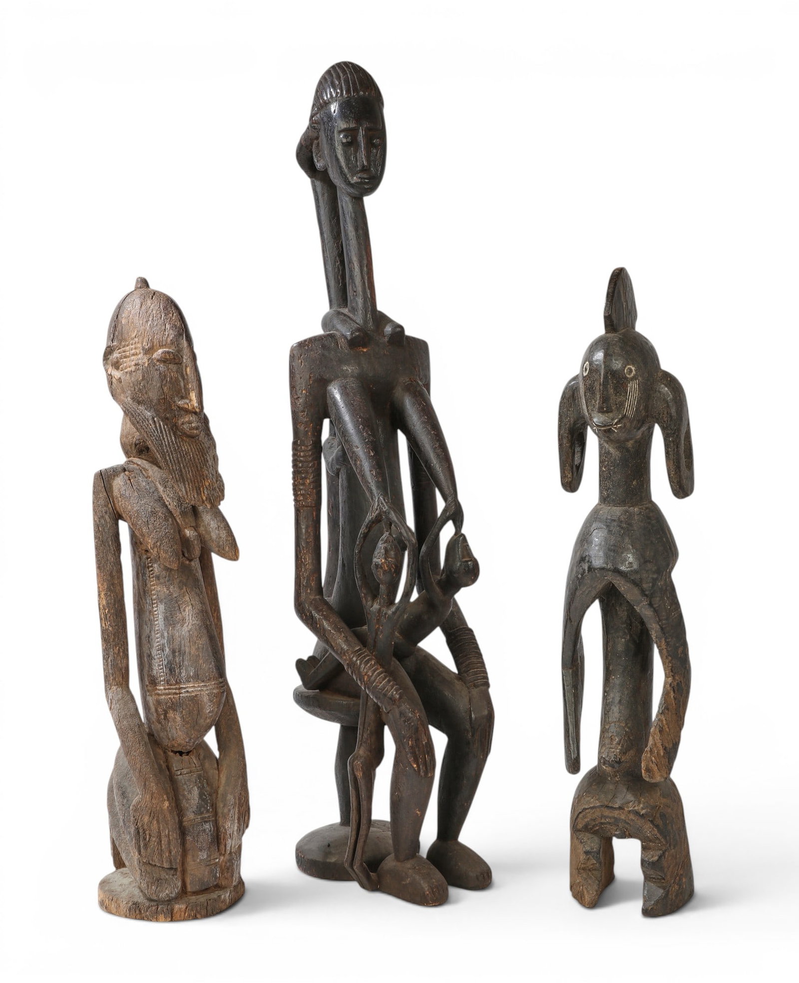 A group of three West African sculpted hardwood figures, possibly Makonde and Mumuye cultures (1 of 4)