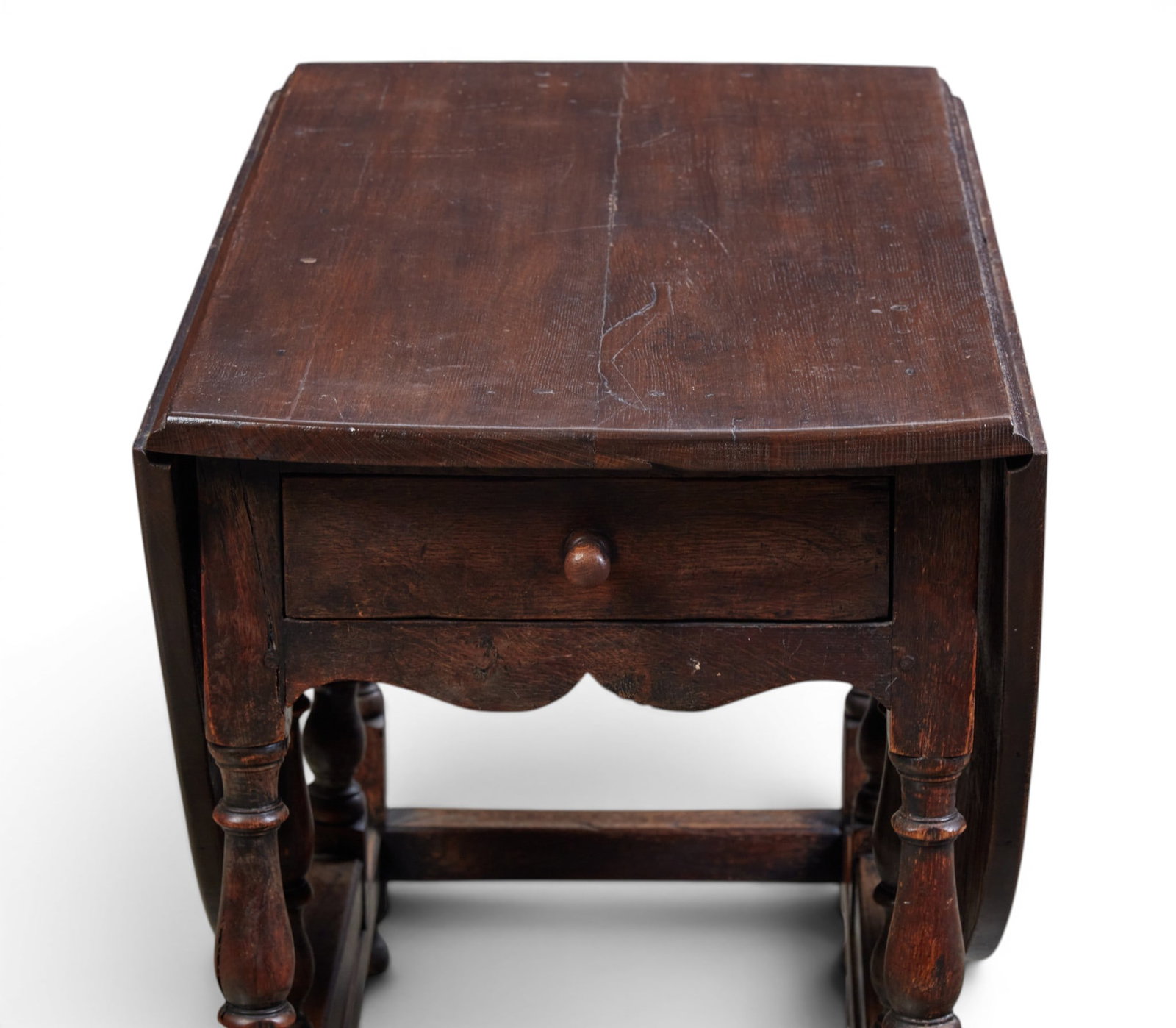 An oval drop leaf table with single drawer - 3