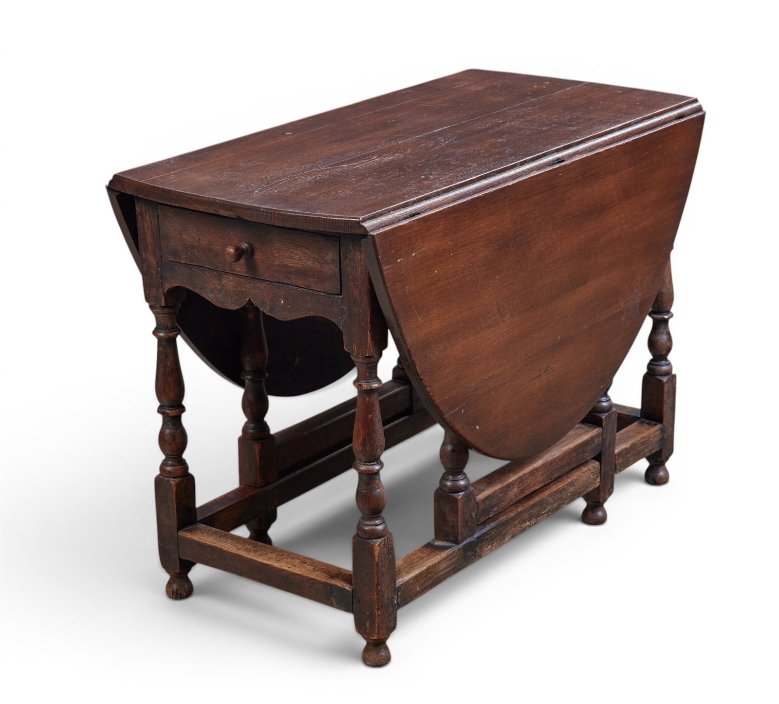 An oval drop leaf table with single drawer - 4