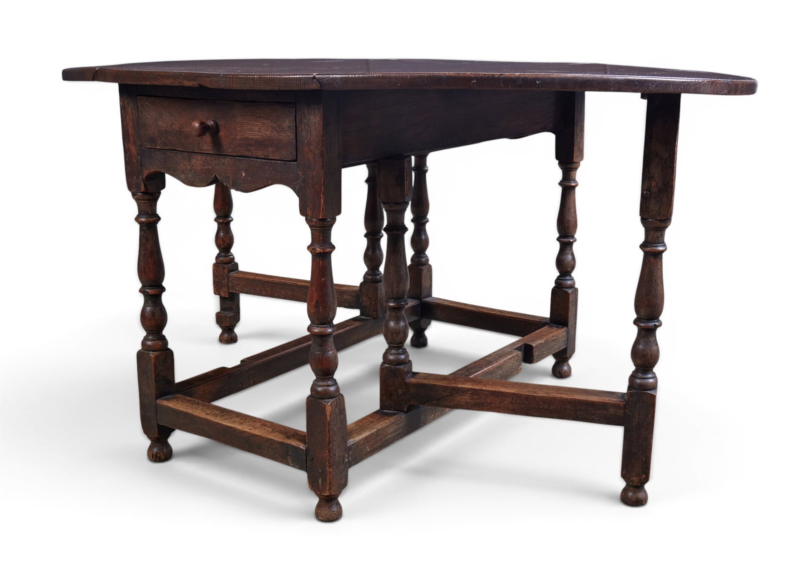 An oval drop leaf table with single drawer - 7