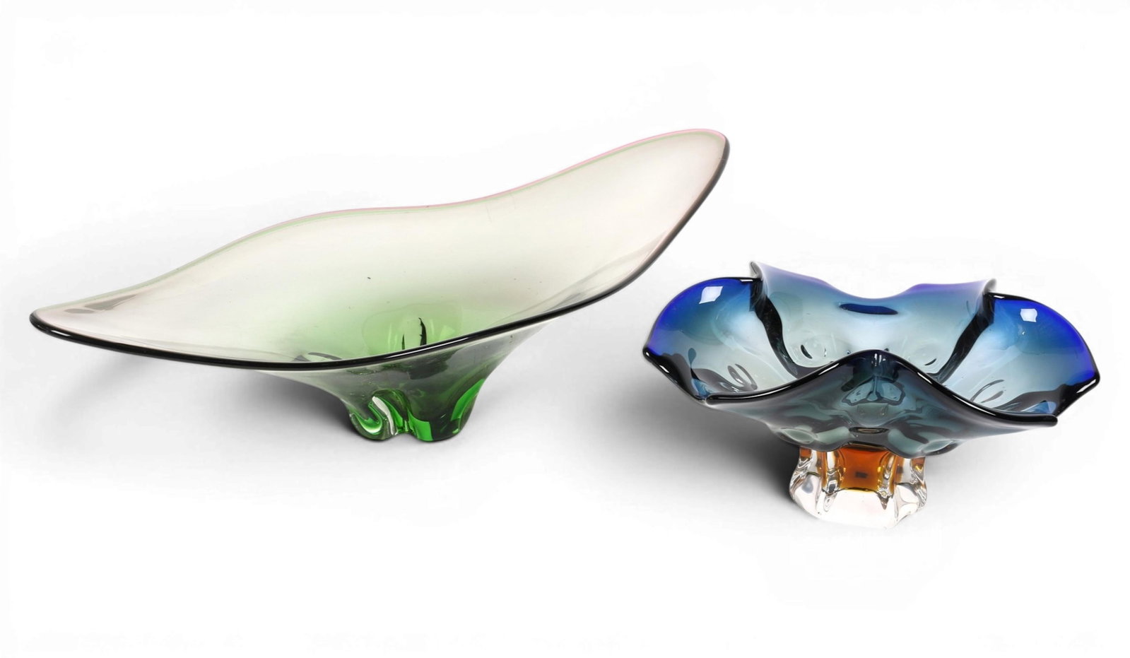A group of two art glass center piece bowls: A group of two art glass center piece bowls Largest: height 7 x width 26 x depth 12 in. (17.8 x 66 x 30.5 cm.)