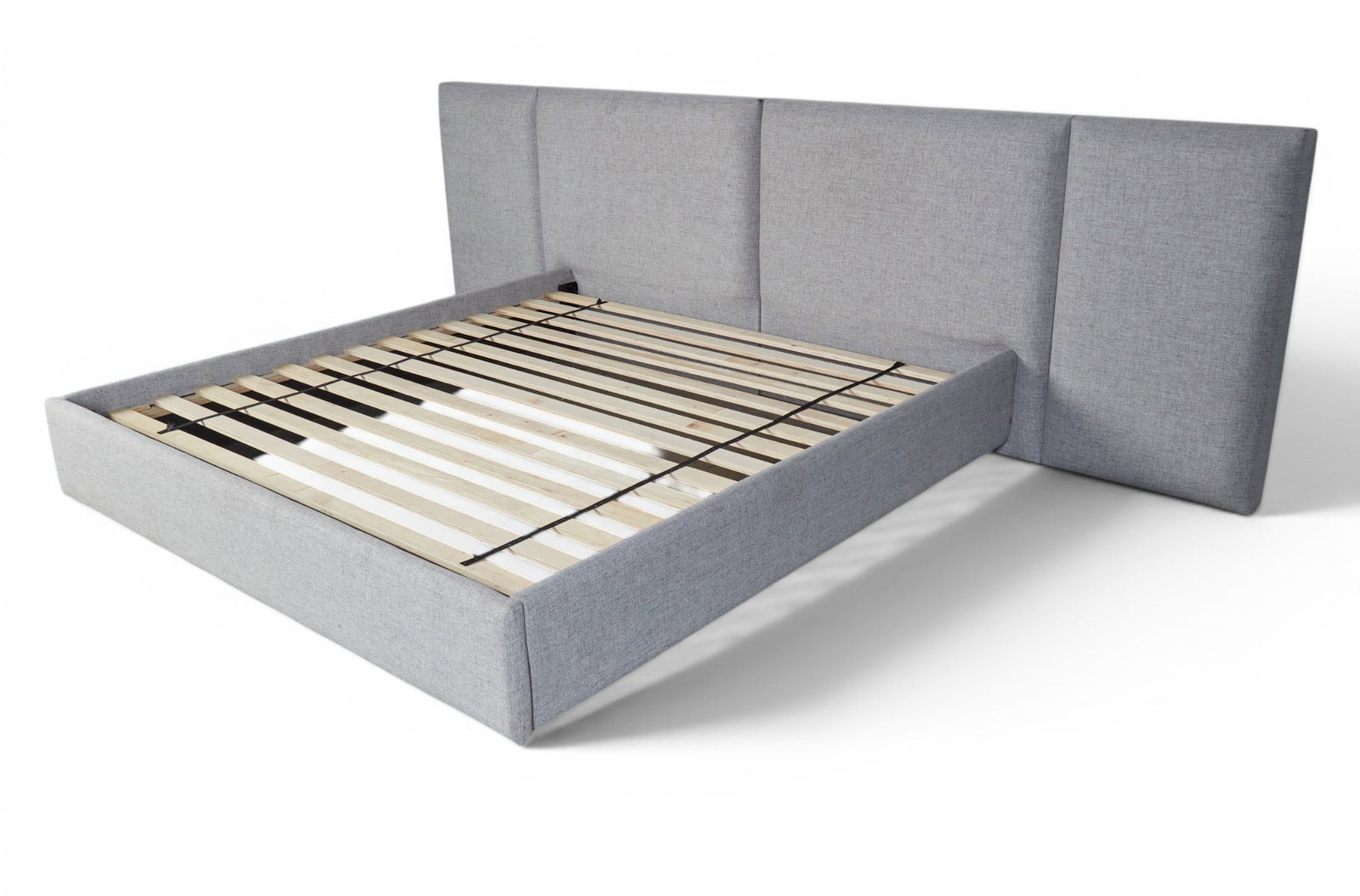 A grey upholstered king size bed - 2