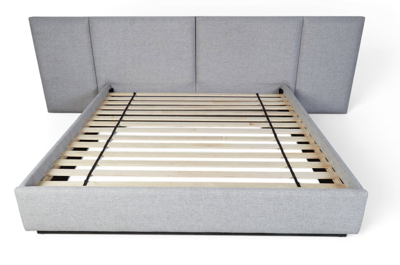 A grey upholstered king size bed - 5