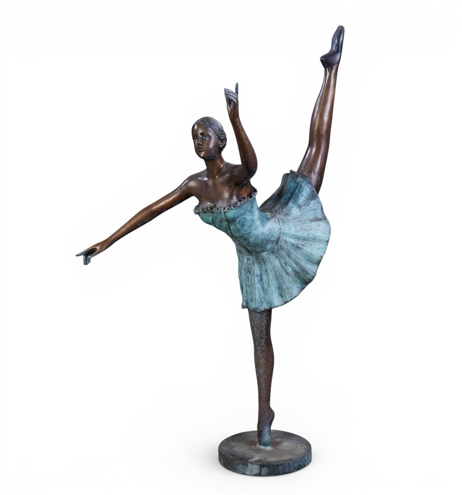 A Bronze ballerina: A Bronze ballerina height 63 x width 29 x depth 31 in. (160 x 73.7 x 78.7 cm.)