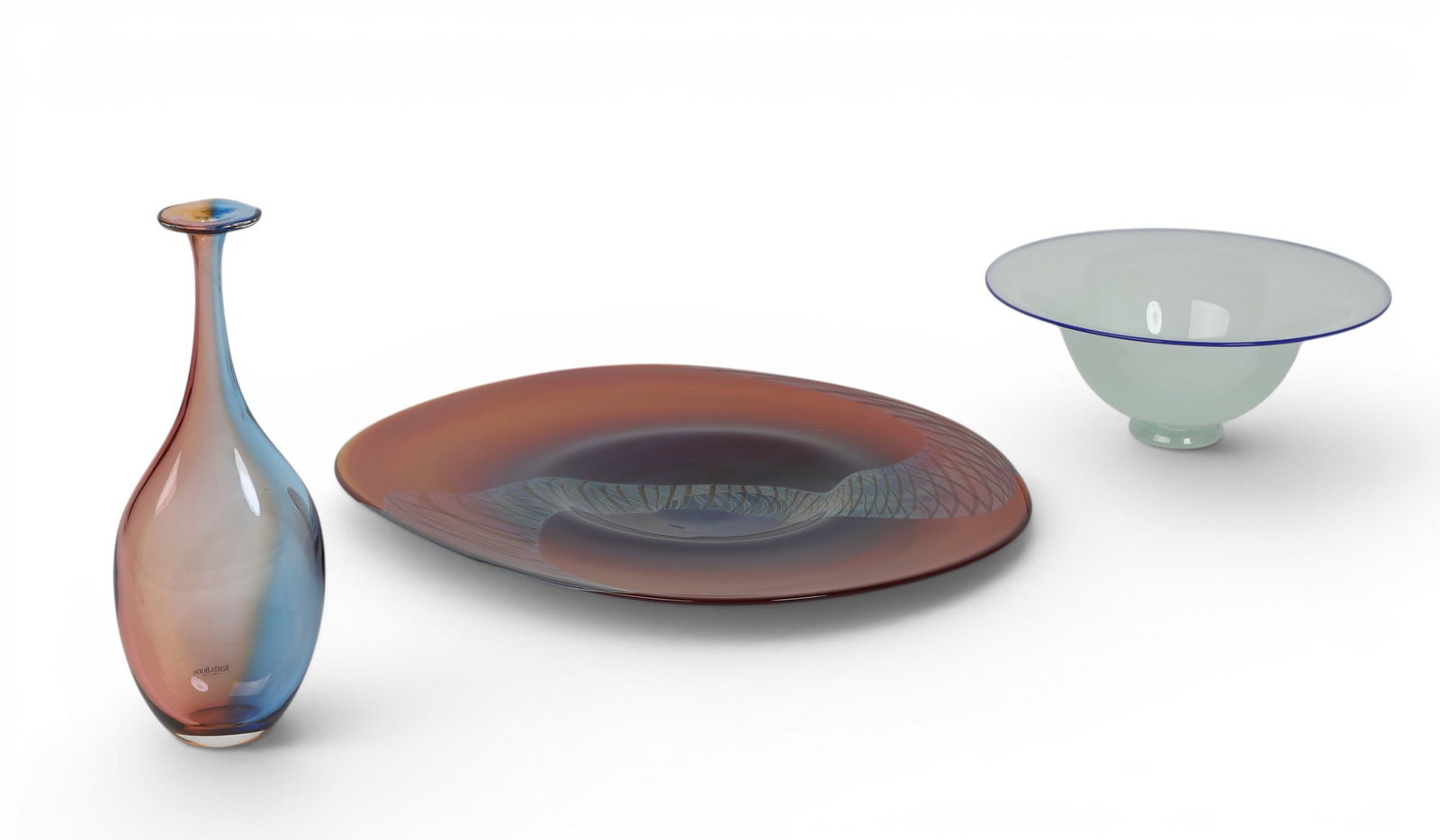 A group of three art glass articles: A group of three art glass articles Large Bowl: height 1 3/4 x width 18 x length 15 in. (4.4 x 45.7 x 38.1 cm.)