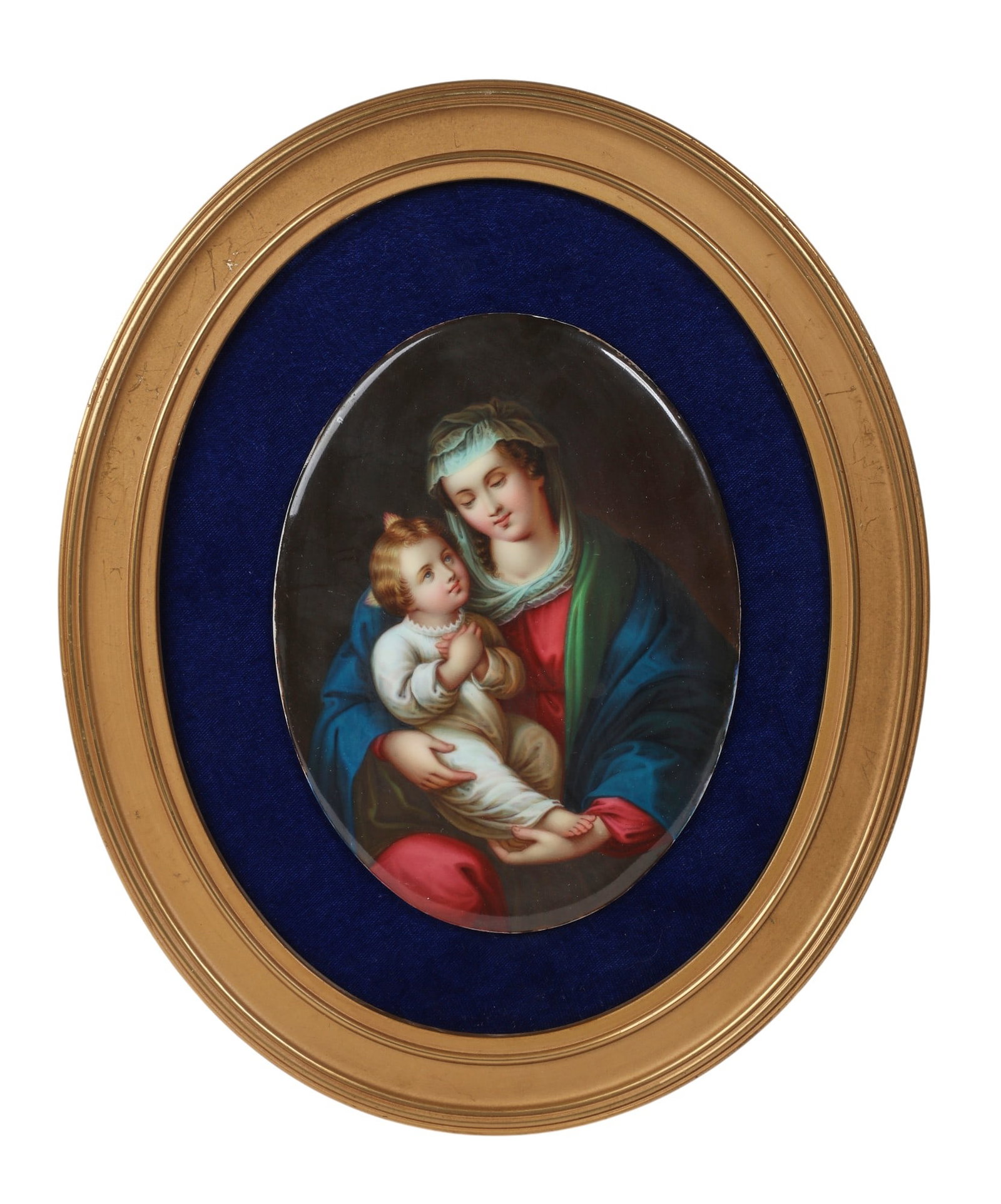 A German porcelain oval plaque: Madonna and Child, 20th century: A German porcelain oval plaque: Madonna and Child 20th century In later giltwood frame. 6 3/4 x 5in (17 x 12.5cm) Provenance: Property from the Collection of Ben Nysewander, Carmel, California.