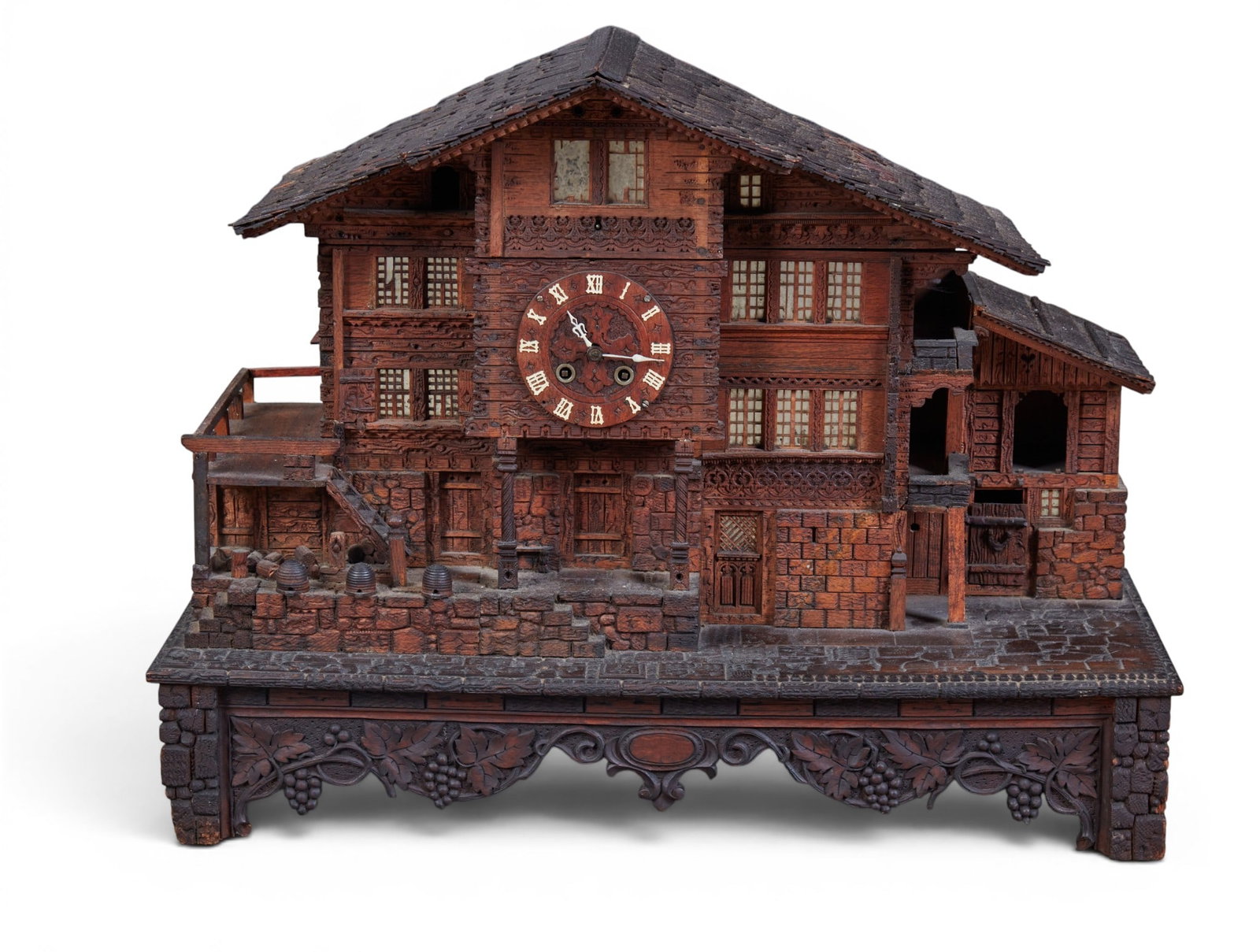 A Black Forest stained mixed wood chalet form clock, 19th century (1 of 10)