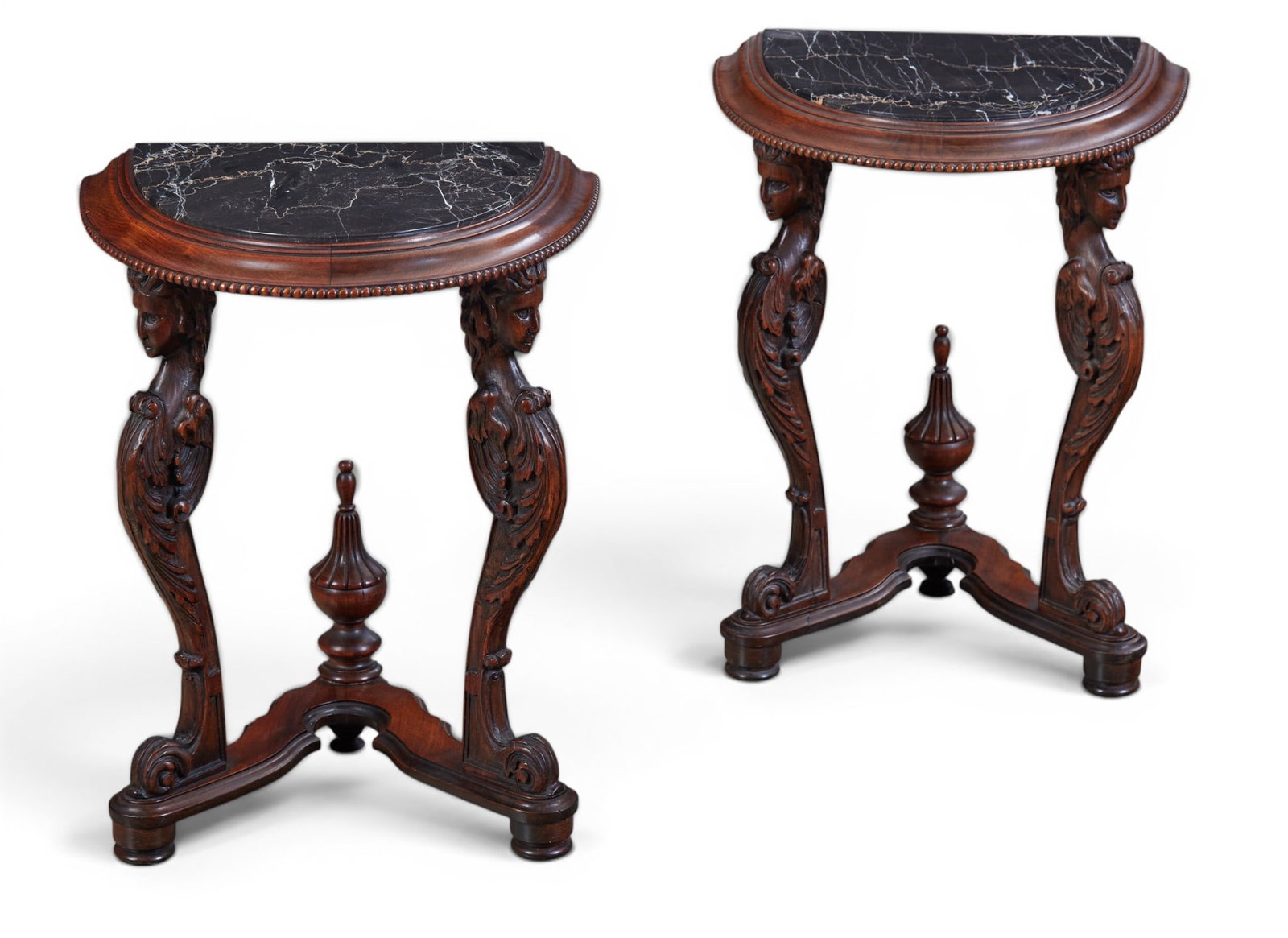 A pair of Renaissance style walnut and black variegated marble demilune side tables: A pair of Renaissance style walnut and black variegated marble demilune side tables early 20th century height 21 1/2in (54.5cm); width 17 1/2in (44.5cm); depth 13 1/2in (34.5cm) Provenance: Property f