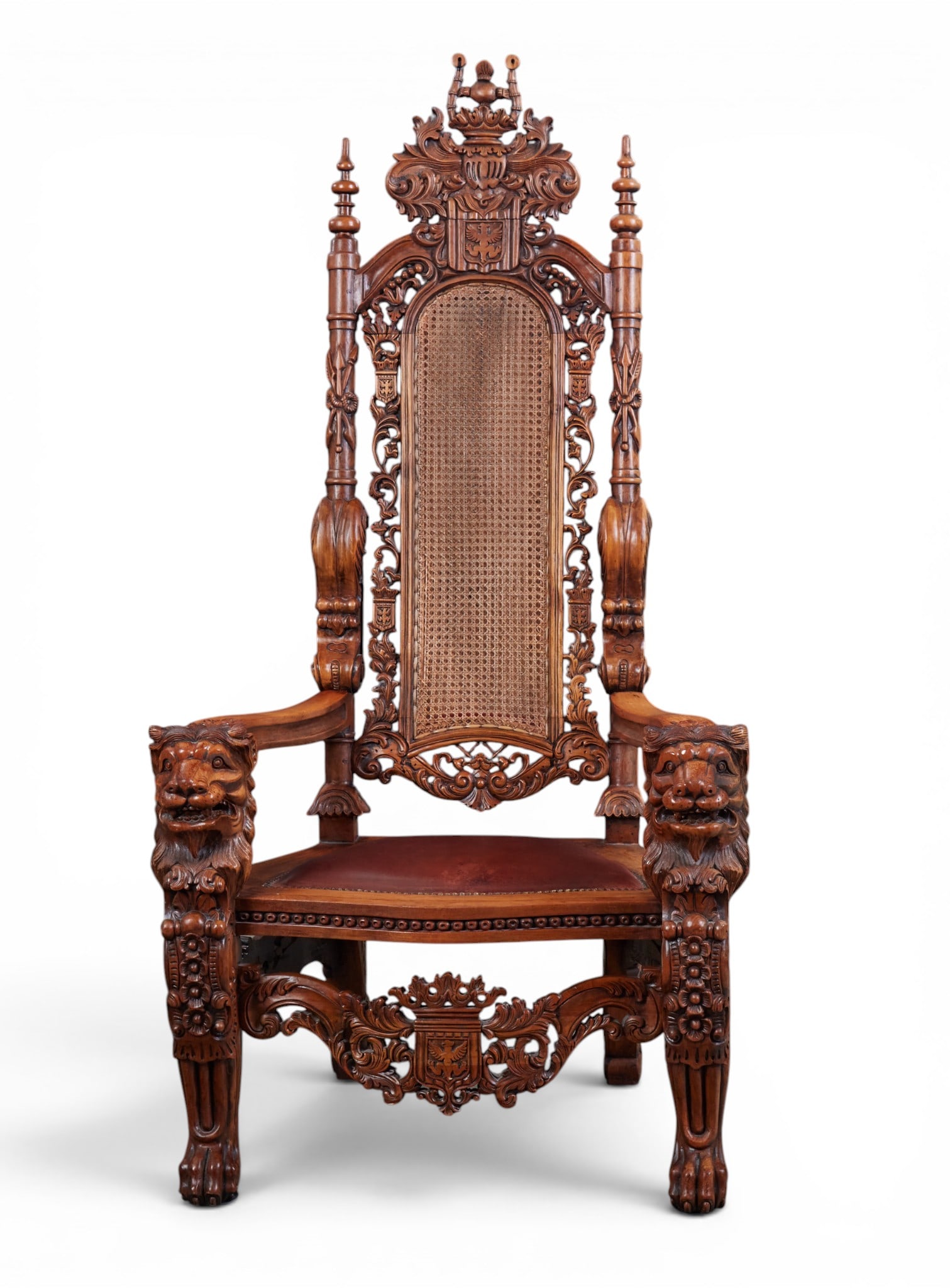 A monumental Renaissance style walnut armchair, 20th century: A monumental Renaissance style walnut armchair 20th century height 69 3/4in (177cm); width 36in (92cm); depth of seat 21in (53cm) Provenance: Property from the Collection of Ben Nysewander, Carmel, Ca