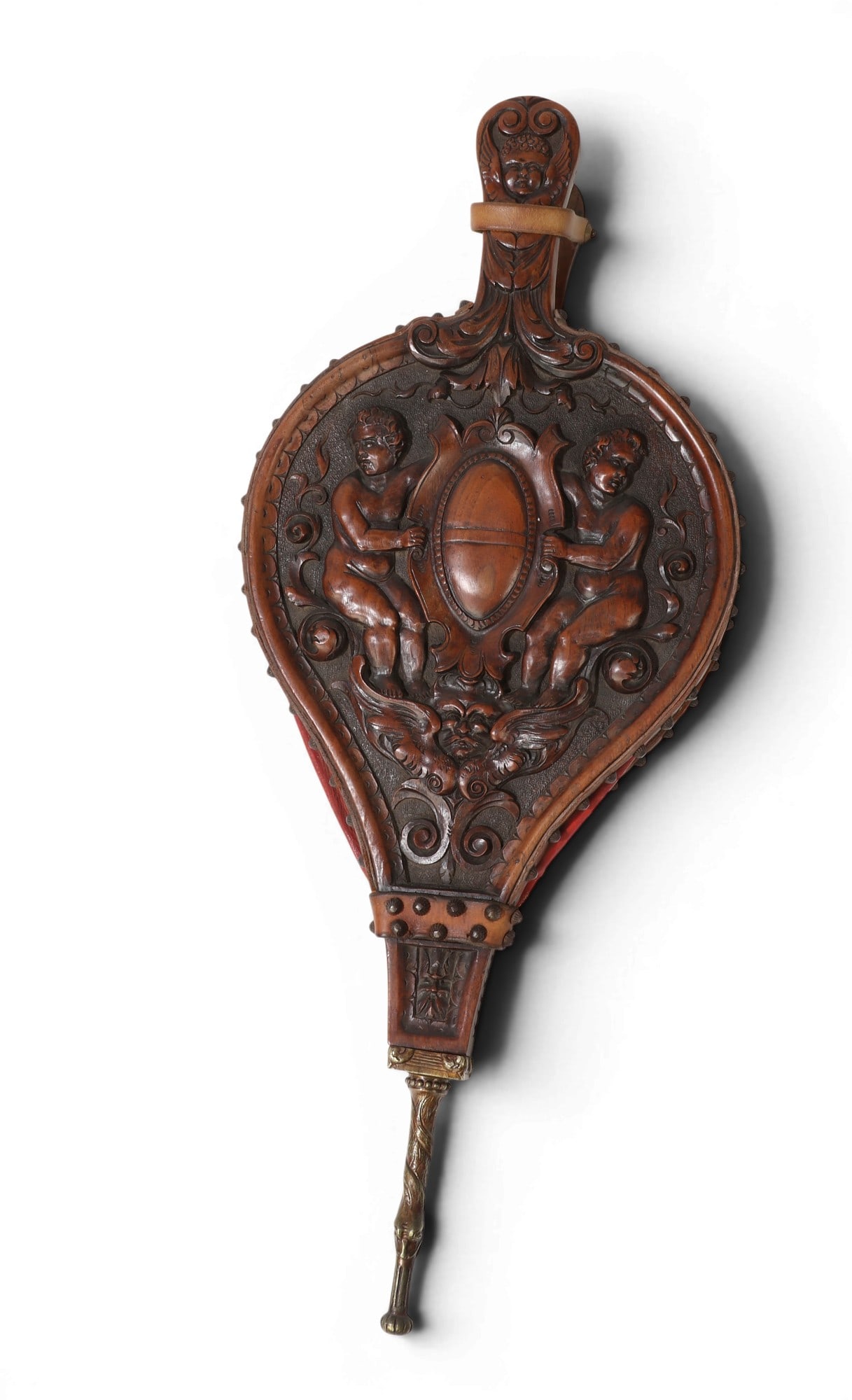 An Italian Renaissance style gilt metal mounted figural carved walnut and leather bellows: An Italian Renaissance style gilt metal mounted figural carved walnut and leather bellows 18th/19th century Depicting putti to one side and a grotesque to the other. height 26 1/2in (67.5cm); width 11