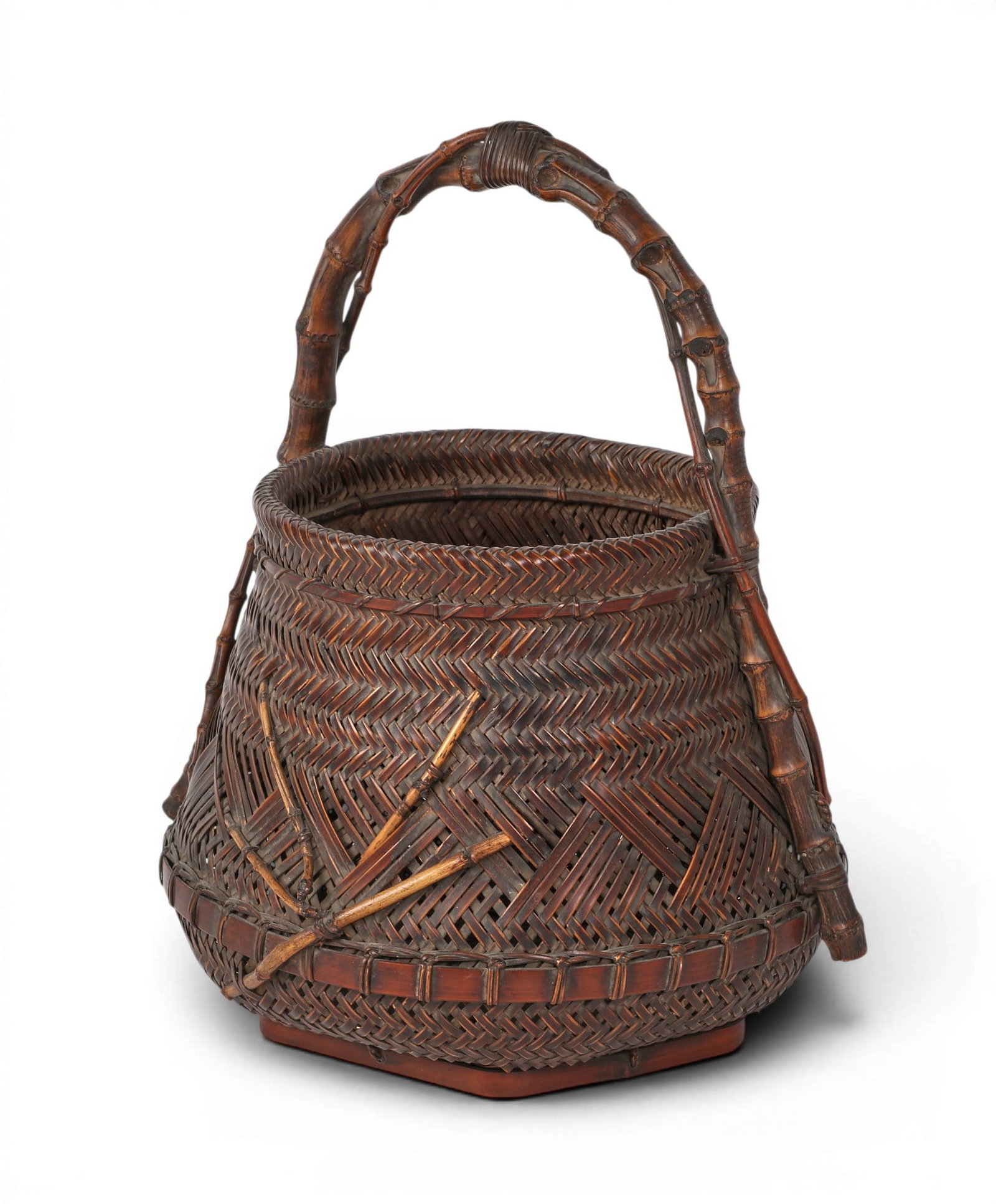 A Japanese woven Ikebana basket / hanakago: A Japanese woven Ikebana basket / hanakago With incised characters to underside. height 15 1/2in (39.5cm); width 13 1/2in (34cm); depth 11 1/2in (29cm) Provenance: Property from the Collection of Ben 