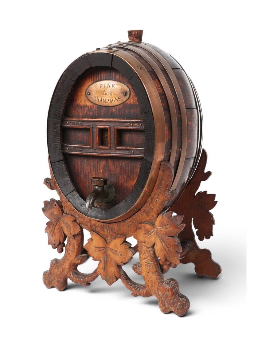 A Continental oak and copper banded champagne barrel on stand, 20th century: A Continental oak and copper banded champagne barrel on stand 20th century height 13in (cm); width 7 3/4in (cm); depth 8 1/4in (cm) Provenance: Property from the Collection of Ben Nysewander, Carmel, 