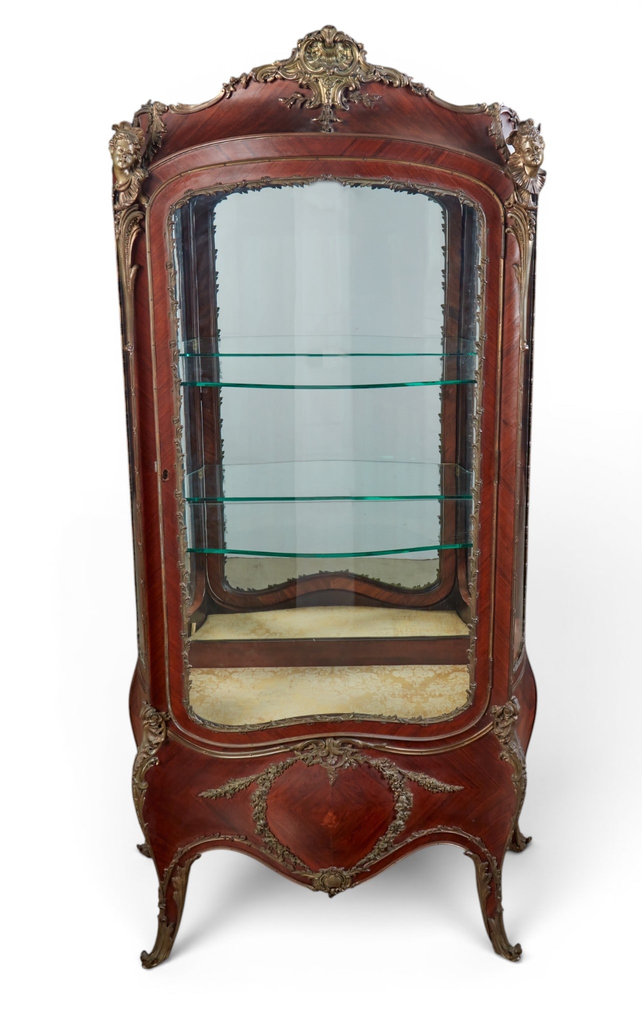 A Louis XV style gilt bronze mounted kingwood vitrine cabinet, early 20th century: A Louis XV style gilt bronze mounted kingwood vitrine cabinet early 20th century height 70in (178cm); width 37 1/2in (95cm); depth 15 1/2in (39cm) Provenance: Property from the Collection of Ben Nysew