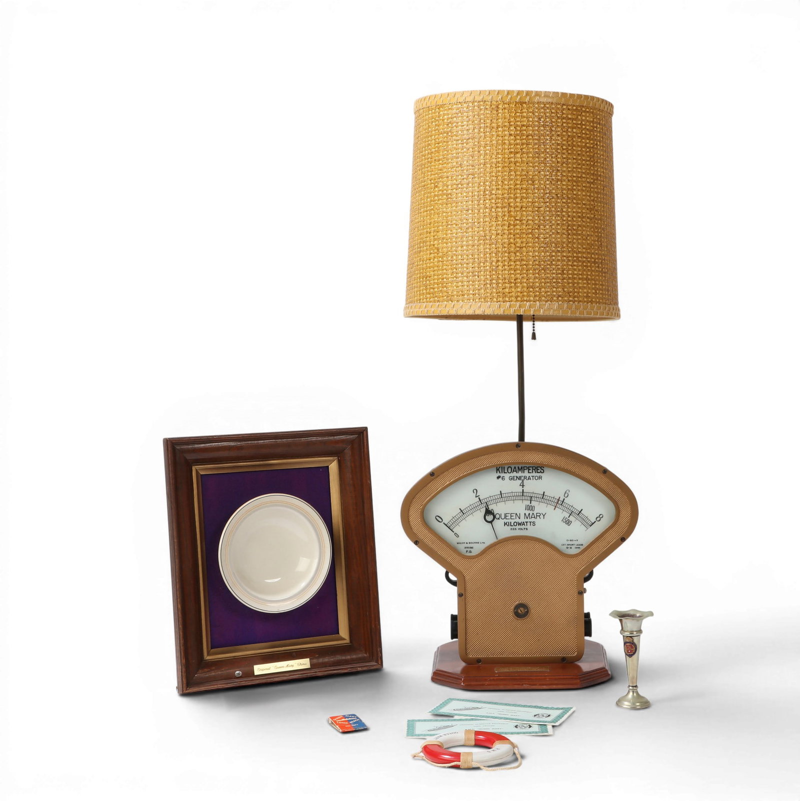 Two pieces of R.M.S. Queen Mary memorabilia, mid 20th century: Two pieces of R.M.S. Queen Mary memorabilia mid 20th century Comprising a gold painted Whipp & Bourne Ltd Kiloamperes #6 generator gauge now as a table lamp and an ivory glazed ceramic rimmed bowl mou