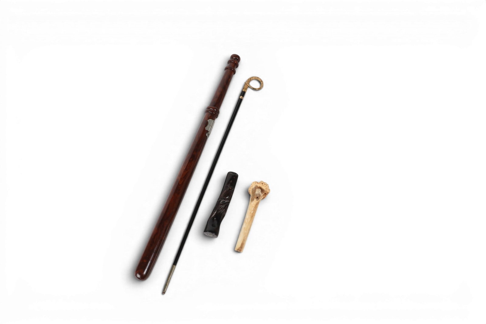 A Continental silver mounted walnut truncheon, circa 1887: A Continental silver mounted walnut truncheon circa 1887 The truncheon inscribed MV Anerswalde d 12 Juni 1887 together with a gilt metal mounted pointing stick, an owl decorated stag horn handle, and 