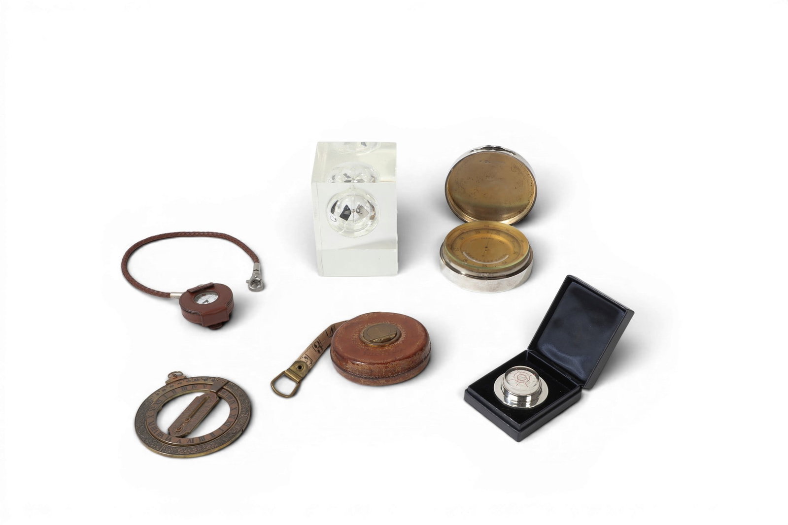 A group of scientific instruments, Tiffany & Co. and other makers, 19th/20th century: A group of scientific instruments Tiffany & Co. and other makers 19th/20th century Comprising an English silver cased thermometer/barometer hallmarked London, 1900, maker WEW, retailed by Percy Edward
