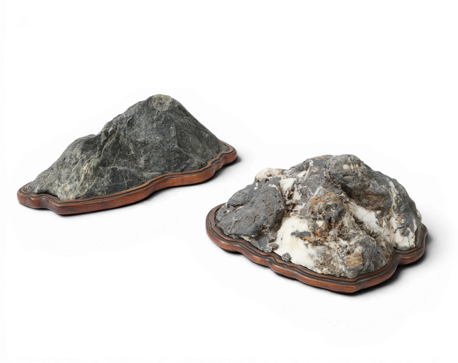 Two Japanese Suiseki landscape stones: Two Japanese Suiseki landscape stones On fitted daiza together with a book: The Japanese Art of Stone Appreciation: Suiseki and Its Use with Bonsai. Vincent T. Covello and Yuji Yoshimura. Tokyo: Charl