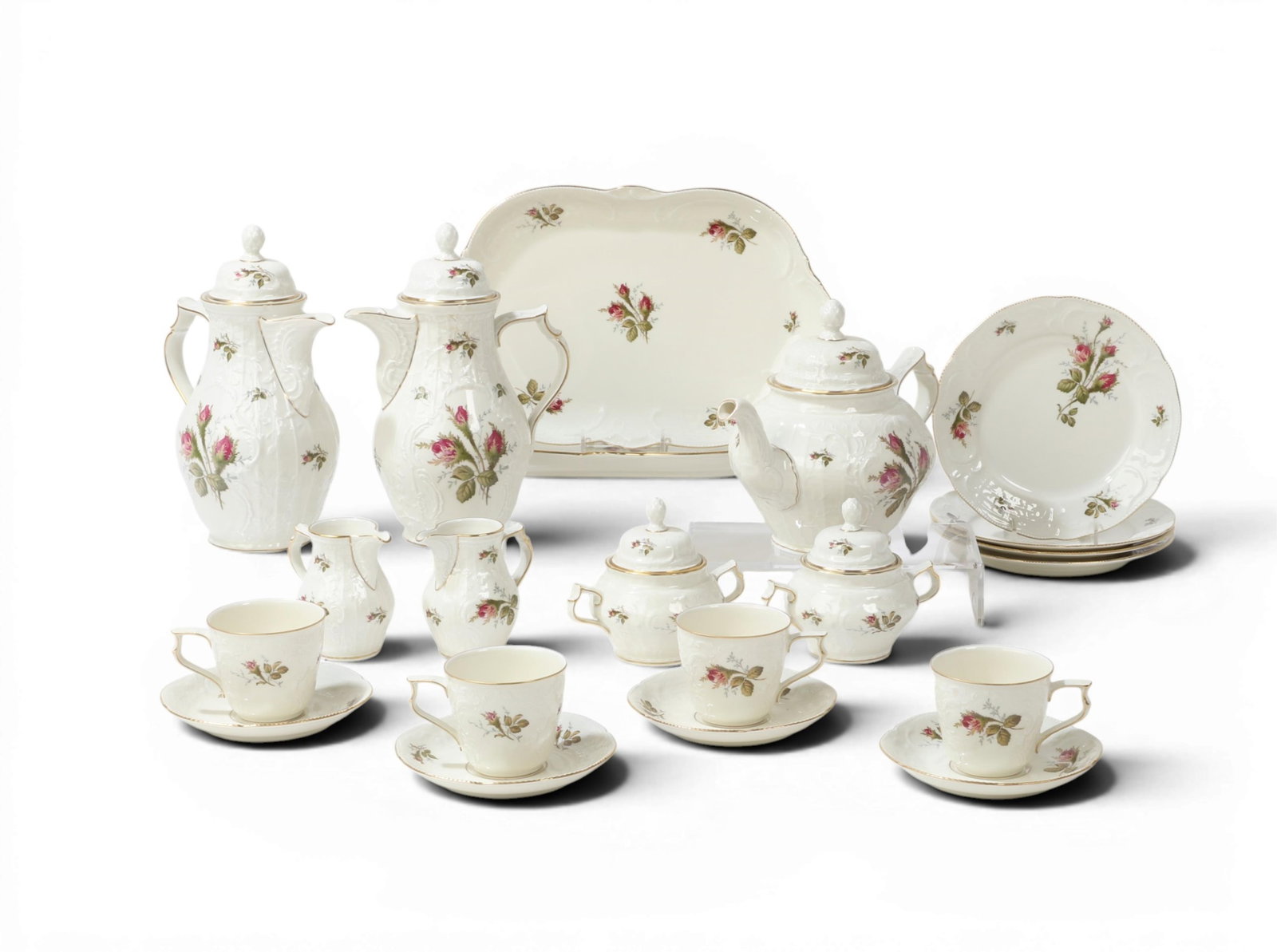 A Rosenthal Moss Rose embossed porcelain part coffee and tea service, second half 20th century: A Rosenthal Moss Rose embossed porcelain part coffee and tea service second half 20th century Comprising a teapot, two 10in (25.5cm) coffee pots, two cream jugs, two covered sugar bowls, four cups and