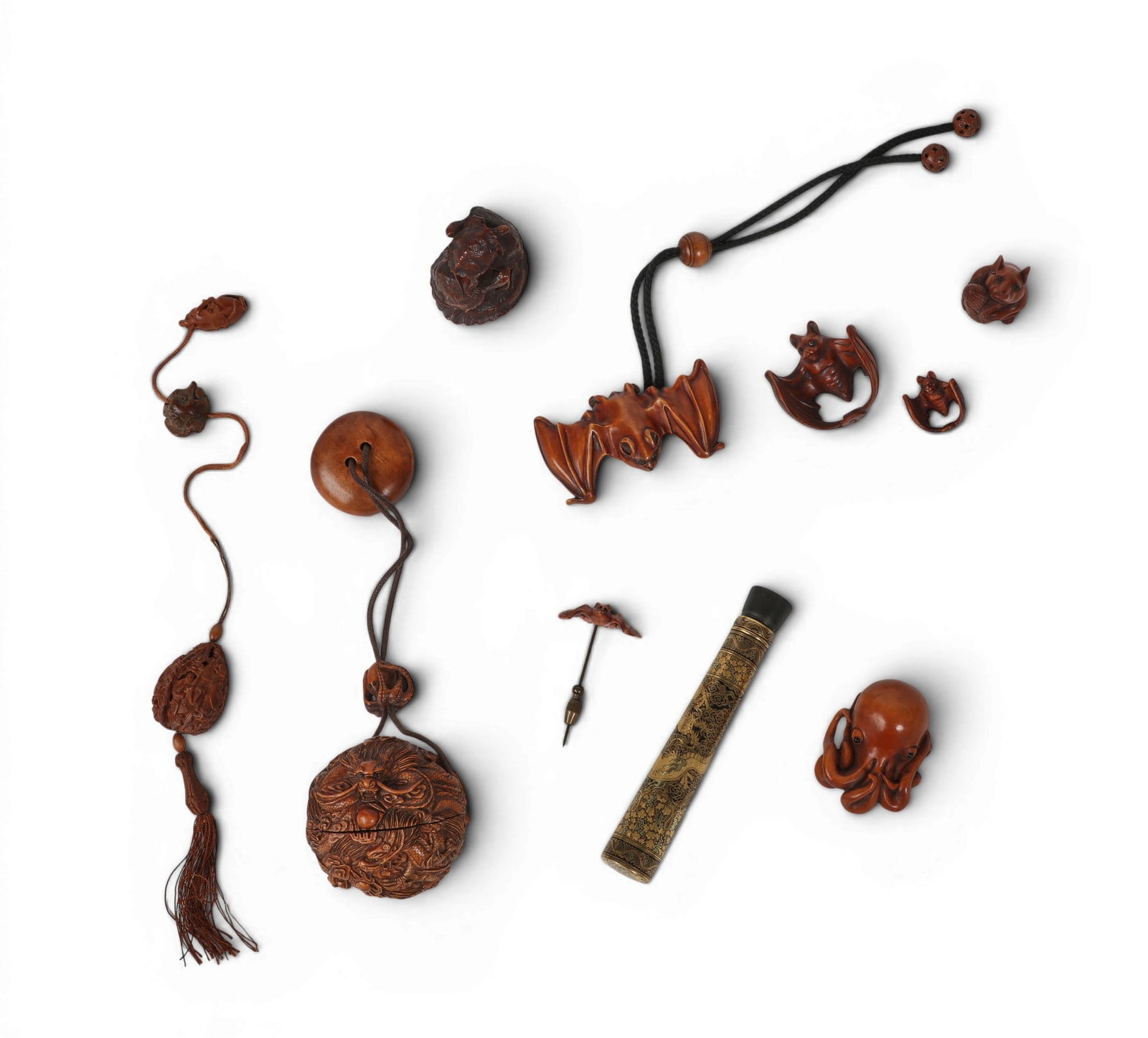 A group of nine Japanese carved wood netsuke and inro (1 of 3)