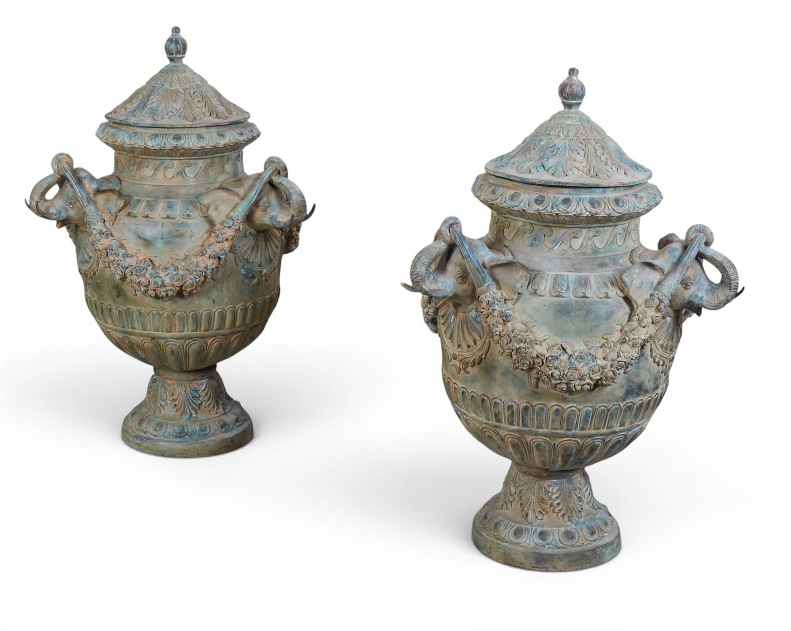 A pair of Neoclassical style patinated metal covered garden urns, modern: A pair of Neoclassical style patinated metal covered garden urns modern approximate height 45in (114.5cm); diameter 30in (76cm)