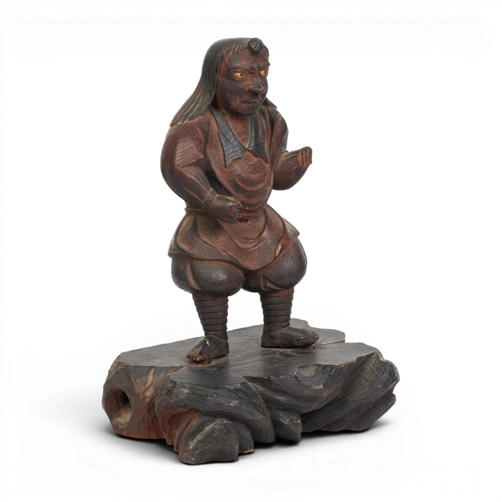 A Japanese stained wood model of a Tengu: A Japanese stained wood model of a Tengu height 10 3/4in (27cm); width 6 1/2in (16.5cm); depth 4 1/2in (11.5cm)