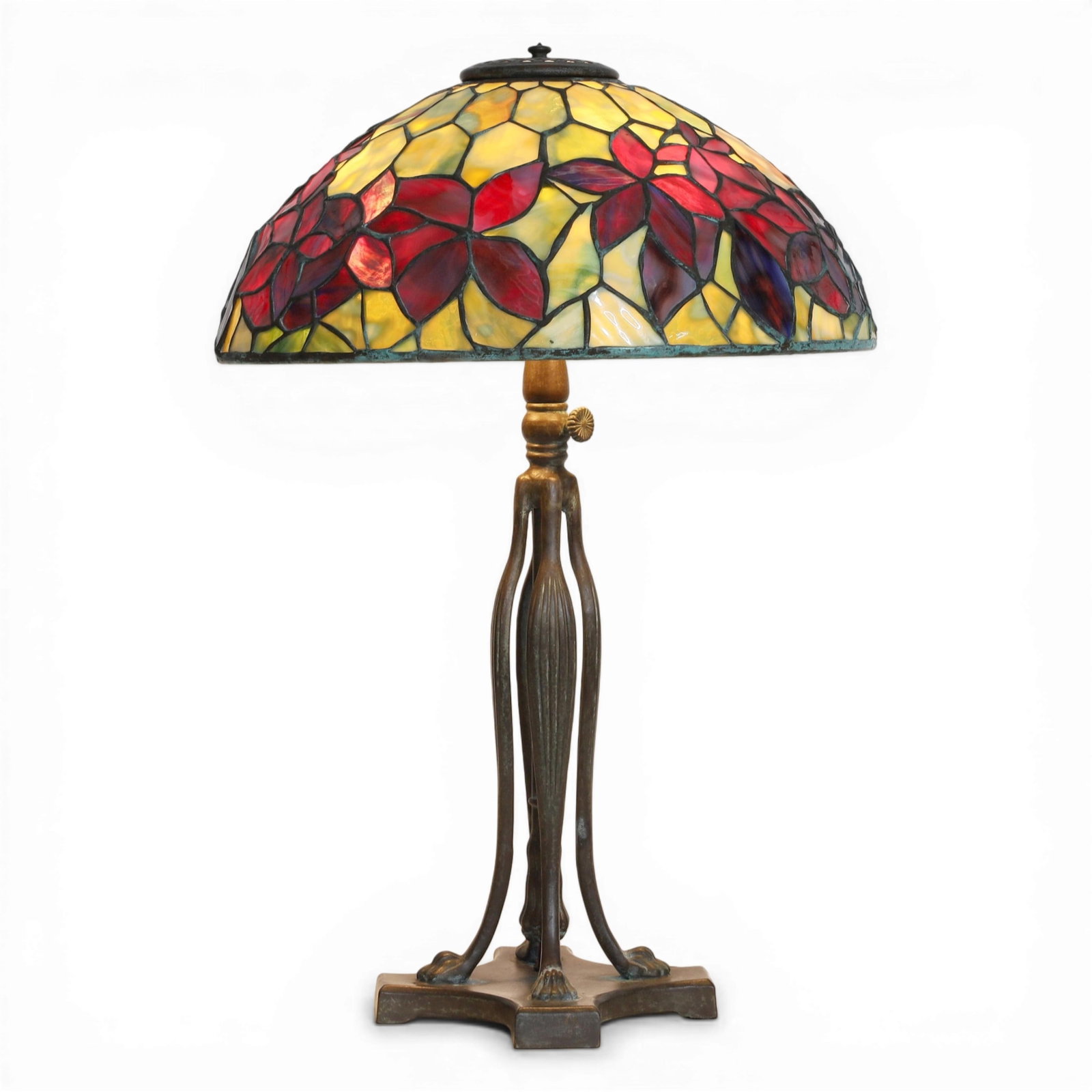 An Arts & Crafts style leaded slag glass table lamp on associated patinated mixed metal base: An Arts & Crafts style leaded slag glass table lamp on associated patinated mixed metal base modern Woodbine shade after the design by Clara Wolcott Driscoll (American, 1861–1944) for Tiffany Studio