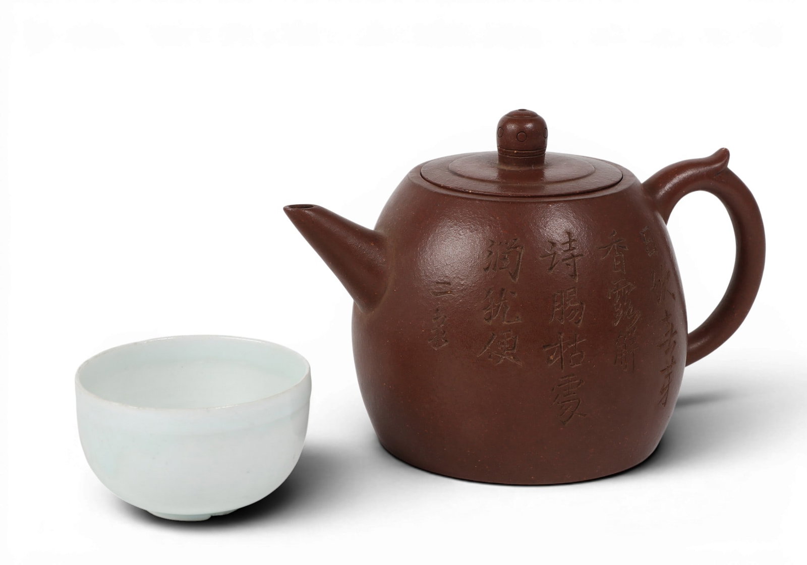 A Chinese Yixing teapot and celadon glazed teacup (1 of 7)
