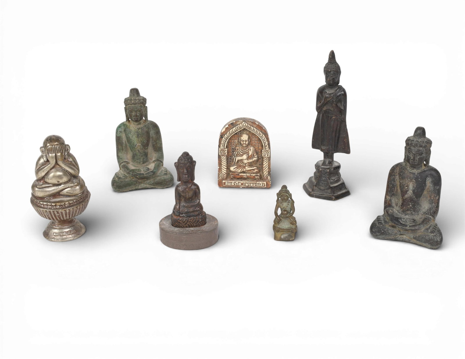 Seven Southeast Asian mixed media Buddhist mixed media amulets and figures (1 of 5)
