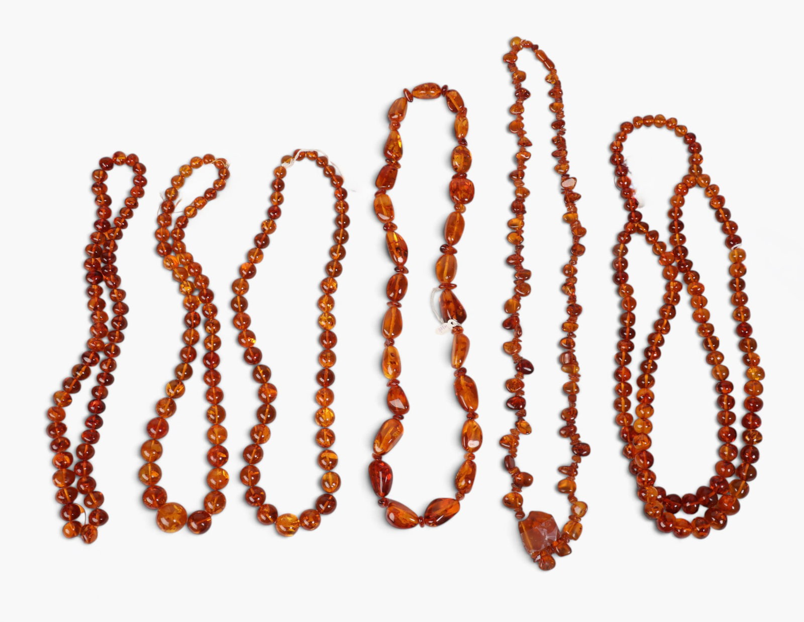 A group of six amber necklaces: A group of six amber necklaces