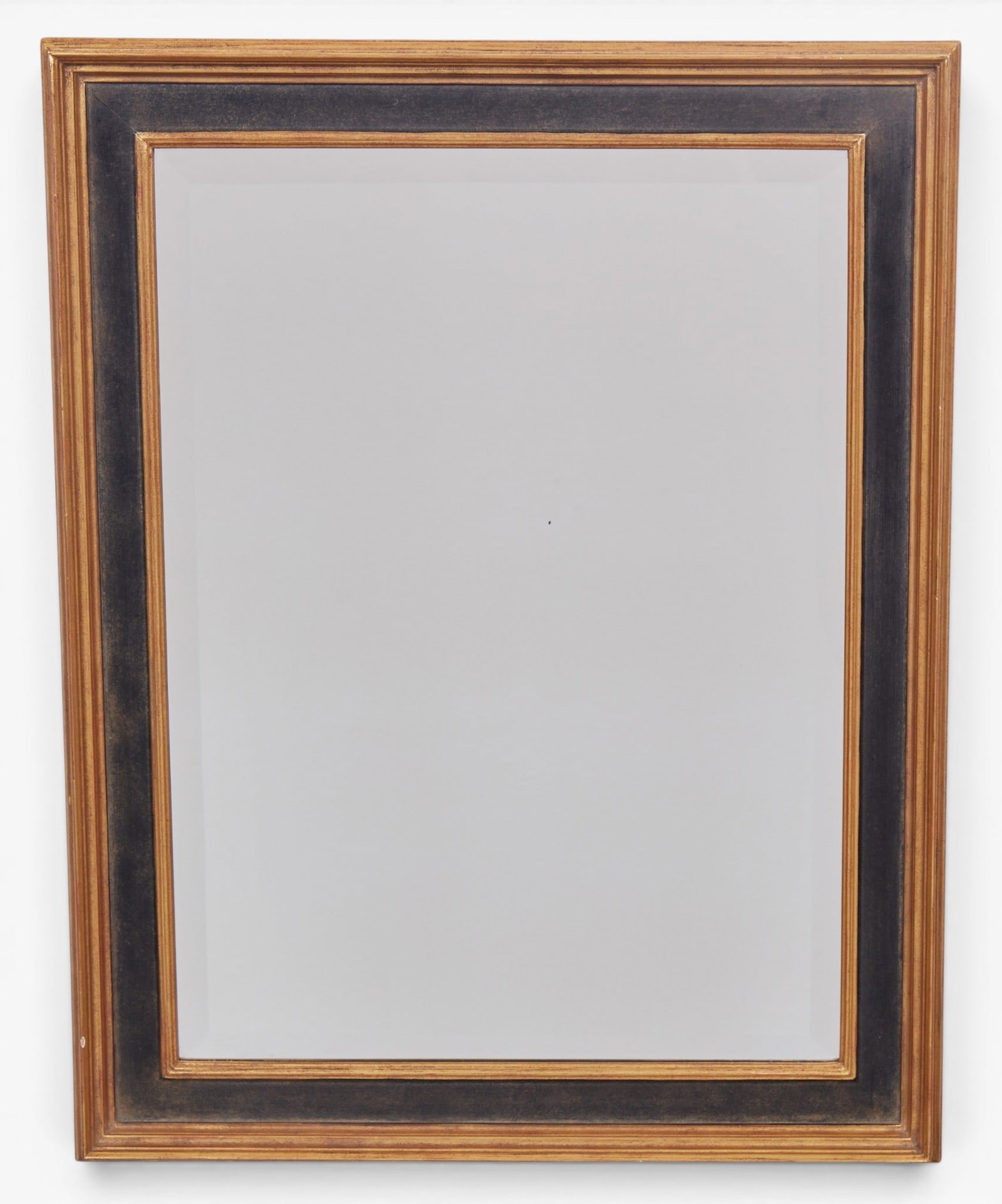 An ebonized and giltwood wall mirror (1 of 5)