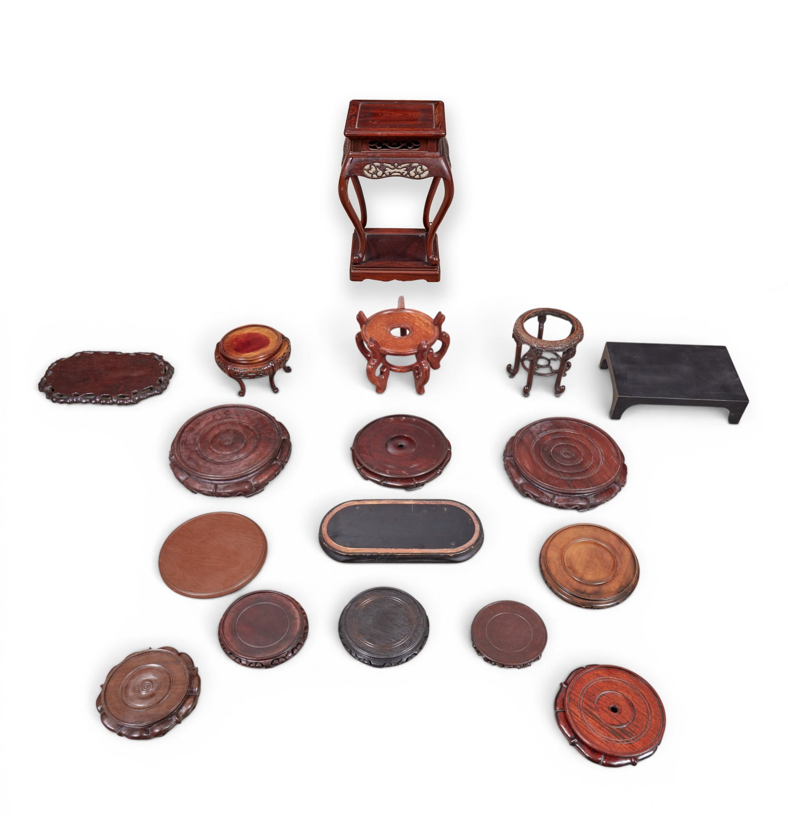 A group of sixteen Asian decorative stands (1 of 8)