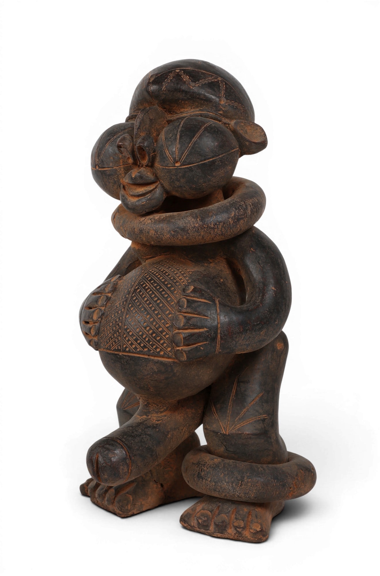 A Cameroonian Tikar home fertility guardian: A Cameroonian Tikar home fertility guardian a blackened and incised Camerooninan clay Tikar home fertility guardian with a cumbersome phallus height 14 x width 8 x depth 8 in (36 x 20 x 20cm)