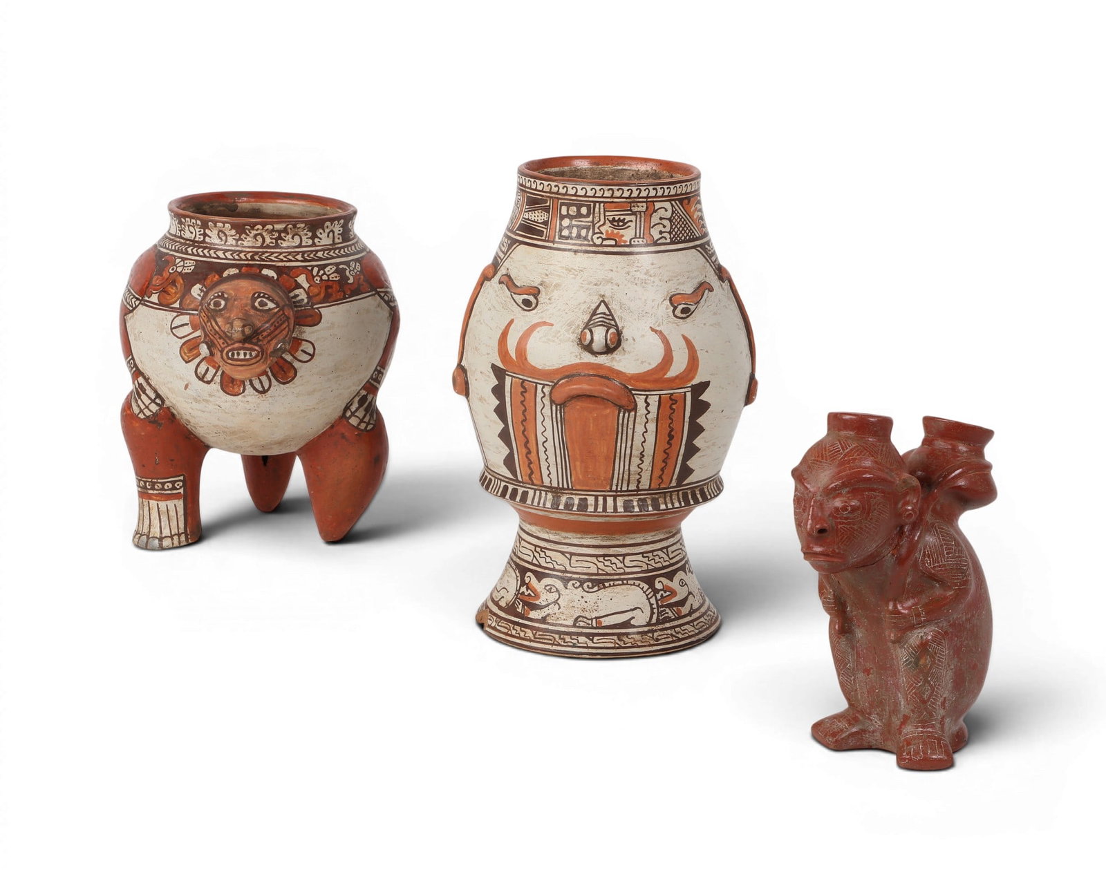 A group of three Mesoamerican polychrome effigy figures: A group of three Mesoamerican polychrome effigy figures lot includes a Colima style (Western Pacific Mexico) parcel burdened figure, possibly fertility vessel; together with two Pataky style Nicoya (C