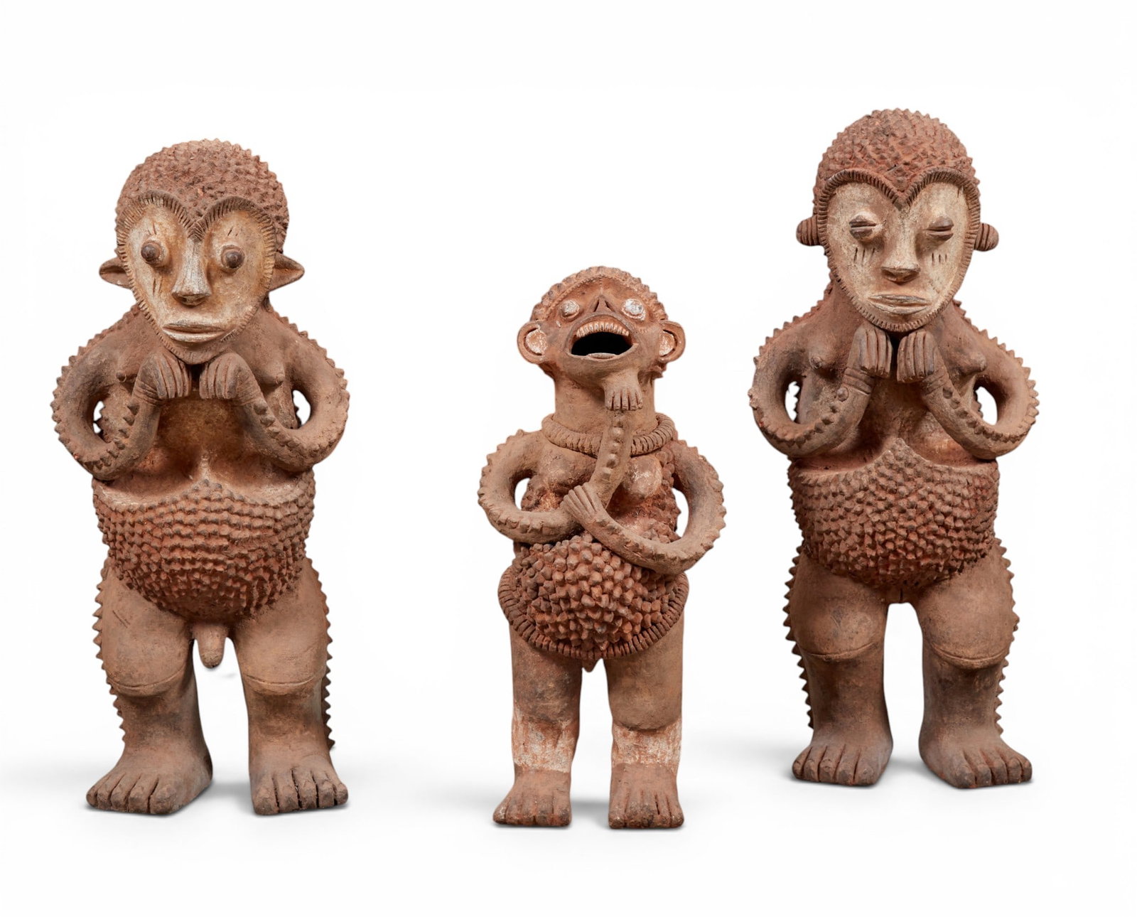 A family of three large terracotta Mambila tadep guardian figures (1 of 7)