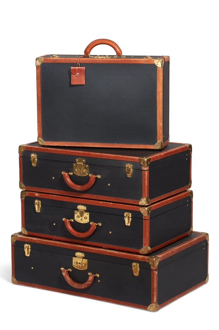 A group of four vintage Bottega Veneta brass mounted leather hardsided suitcases, 20th century: A group of four vintage Bottega Veneta brass mounted leather hardsided suitcases 20th century the largest height 20 3/4in (52.5cm); width 31 1/4in (79cm); depth 10in (25.5cm) Provenance: Property from