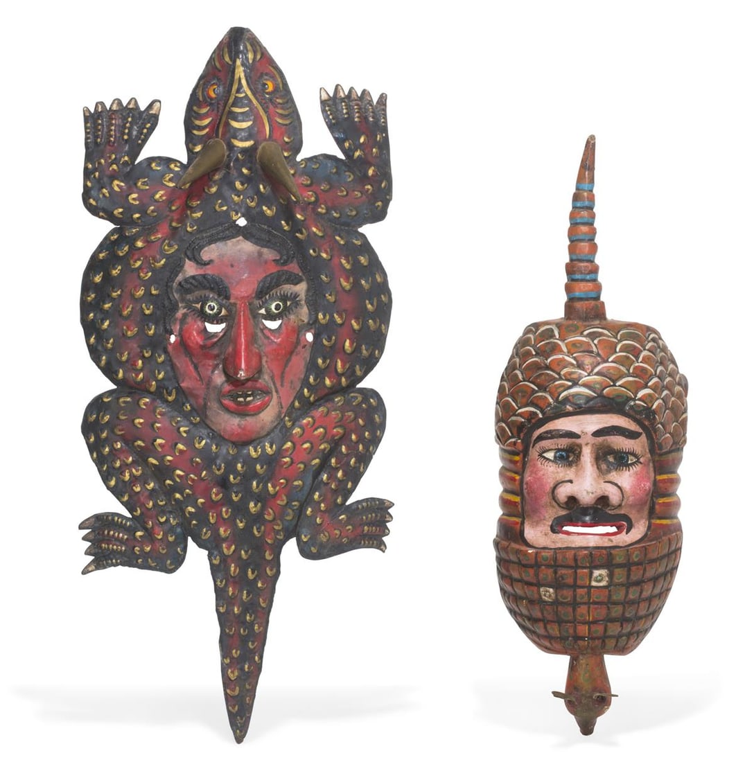 Two Mexican figural polychrome decorated metal and wood dance masks: A group of two Mexican figural polychrome decorated metal and wood dance masks Largest: height 9 x length 28 1/2 in. (22.9 x 72.4 cm.)