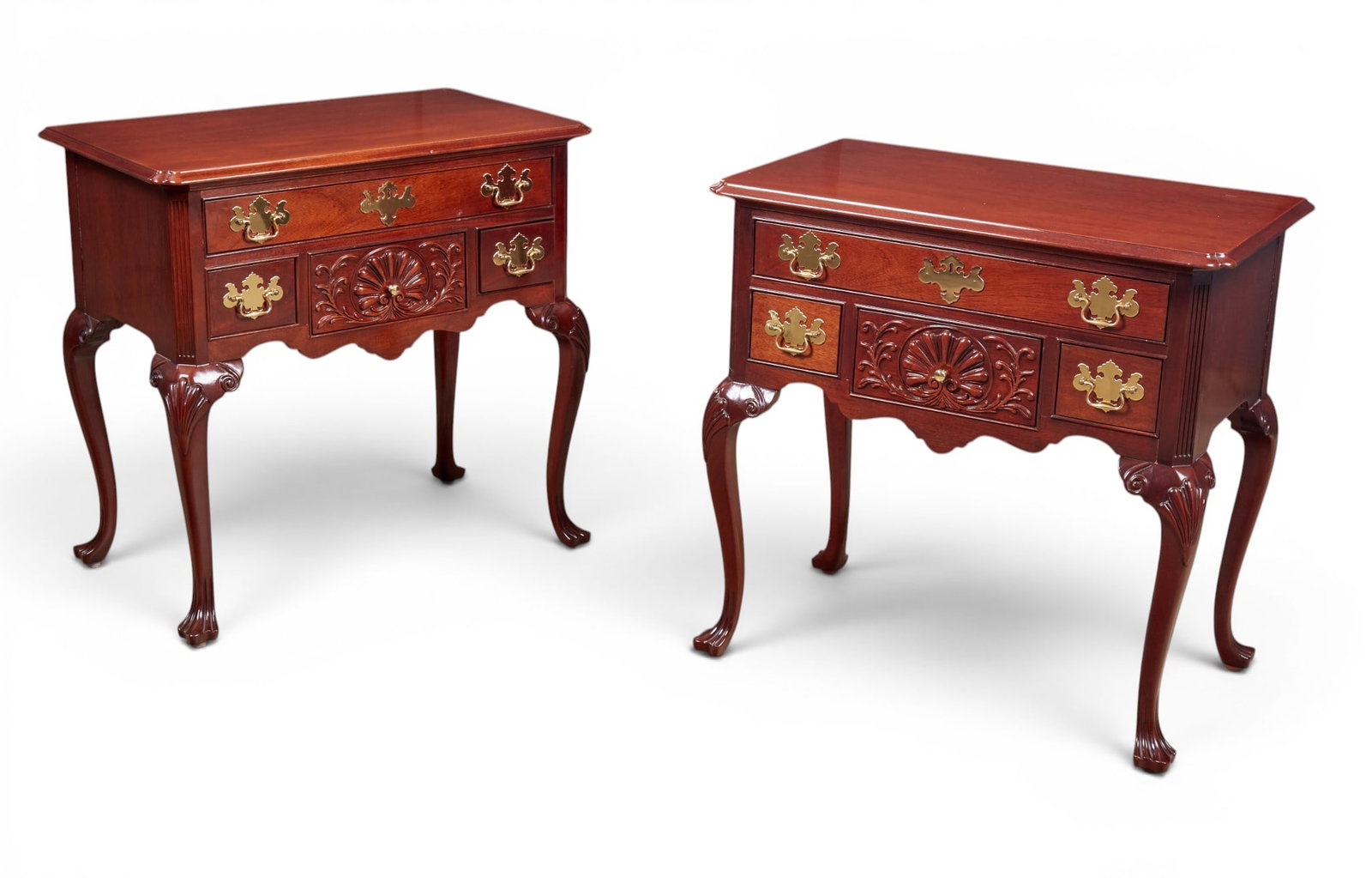 A pair of Mahogany lowboys by Councill: A pair of Mahogany lowboys by Councill height 32 x width 33 x depth 19 in. (81.3 x 83.8 x 48.3 cm.)