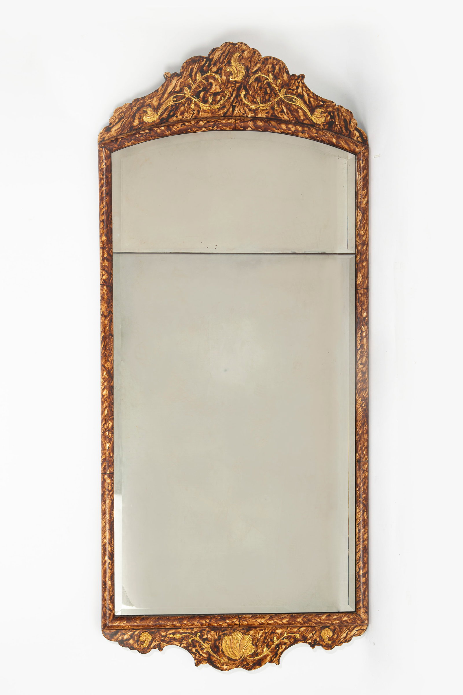 A Continental Rococo style parcel gilt faux tortoise shell painted mirror, 20th century: A Continental Rococo style parcel gilt faux tortoise shell painted mirror 20th century height 57in (145cm); width 24 1/2in (62.5cm)